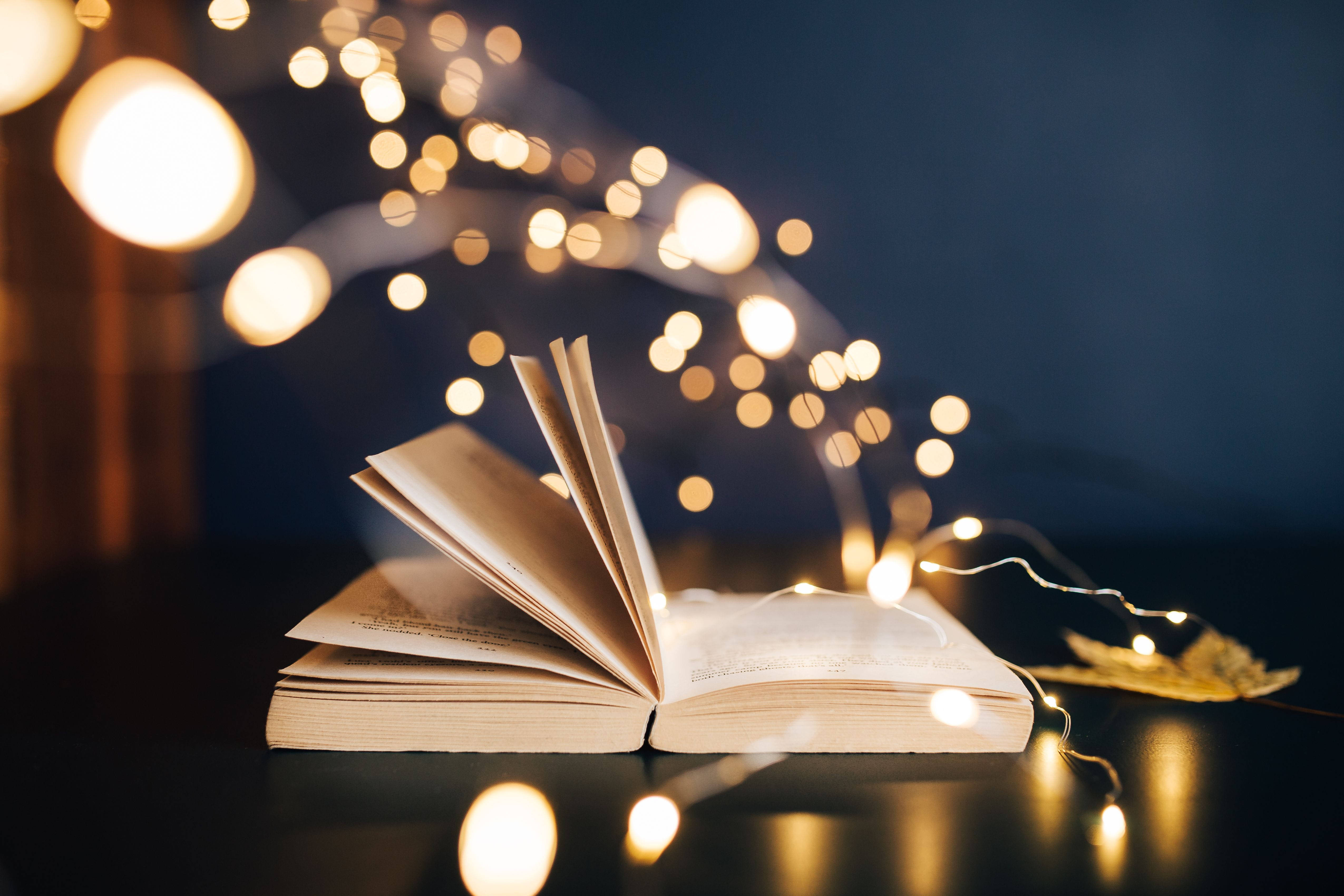 open book, yellow bokeh, glowing string lights, 4K Desktop Wallpaper