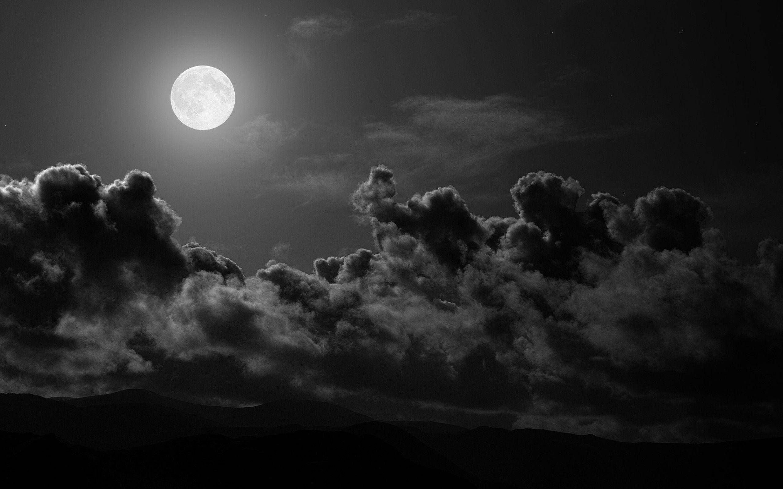 full moon, dramatic clouds, silhouetted mountains, 2K Desktop Wallpaper