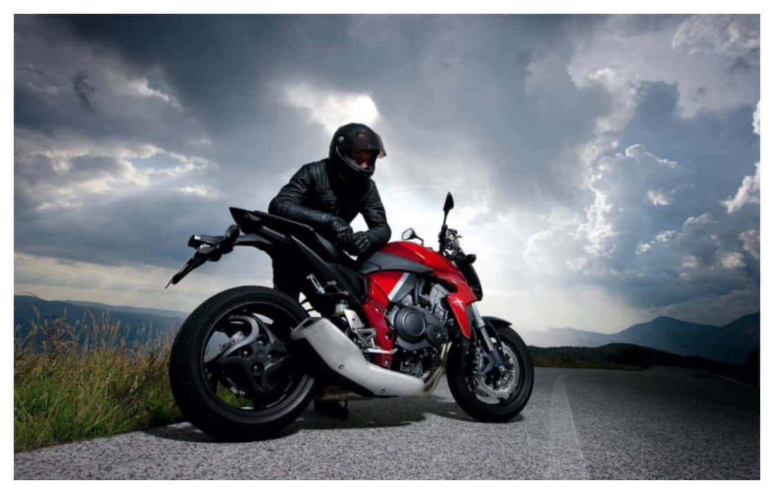 red and black bike, winding mountain road, dramatic cloudy sky, SD Desktop Wallpaper