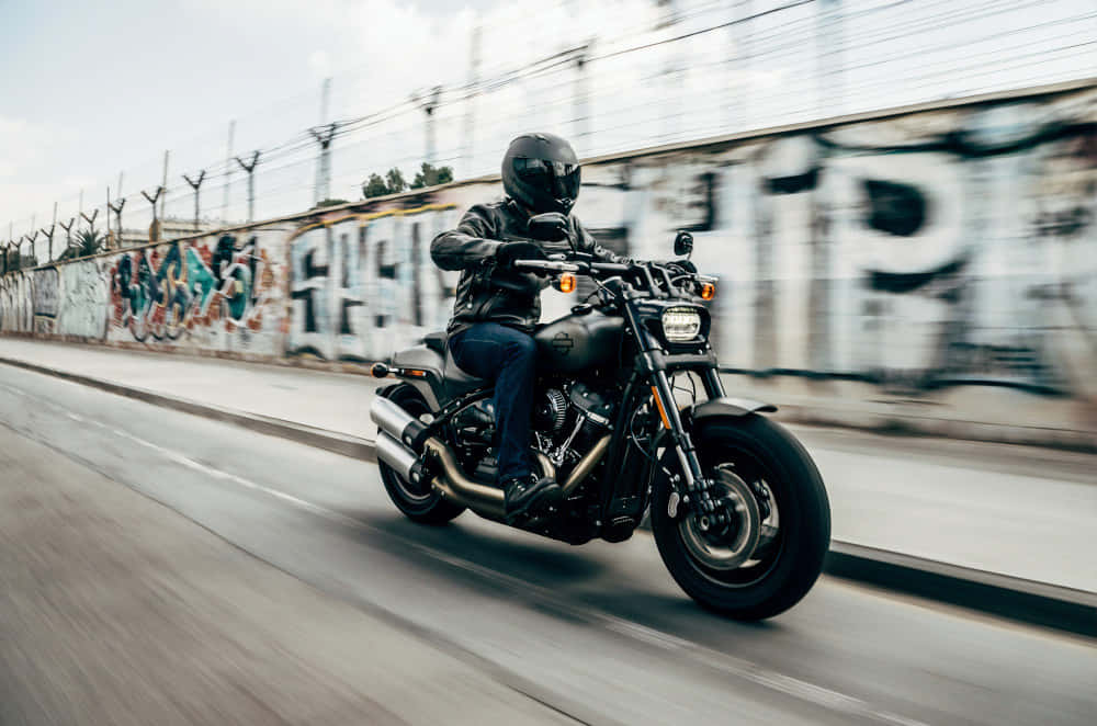 black gear, sleek black cruiser bike, graffiti-covered urban road, SD Desktop Wallpaper