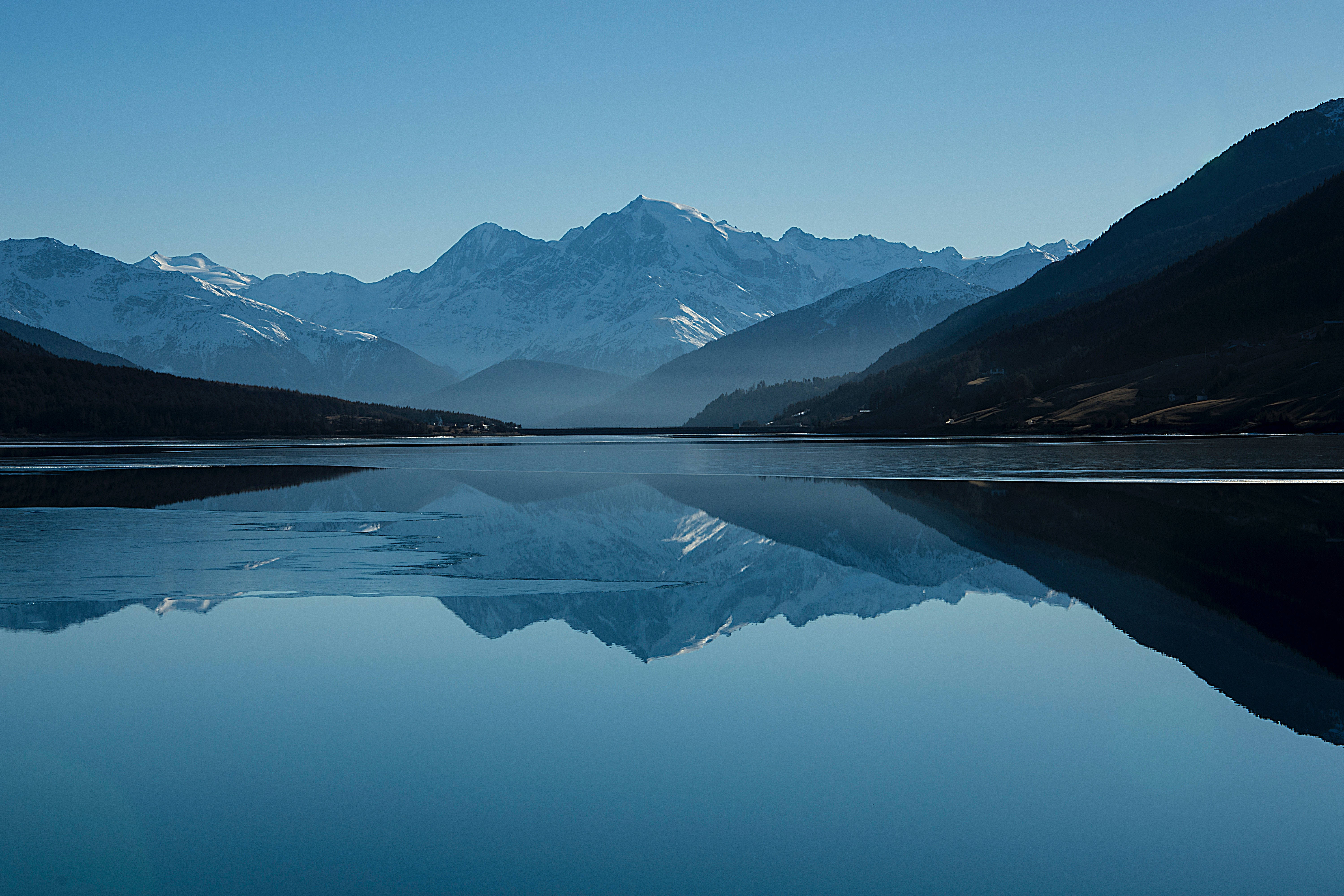 snowcapped mountains, calm blue lake, clear sky, 5K Desktop Wallpaper