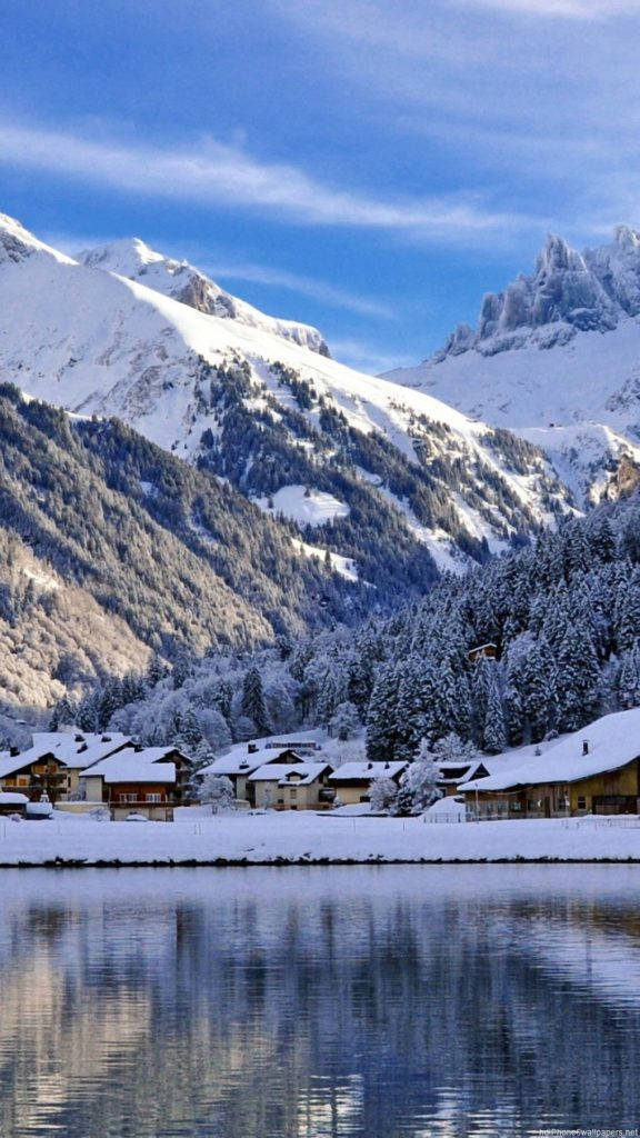 snowcapped HD mountain town, alpine village, calm lake, SD Phone Wallpaper