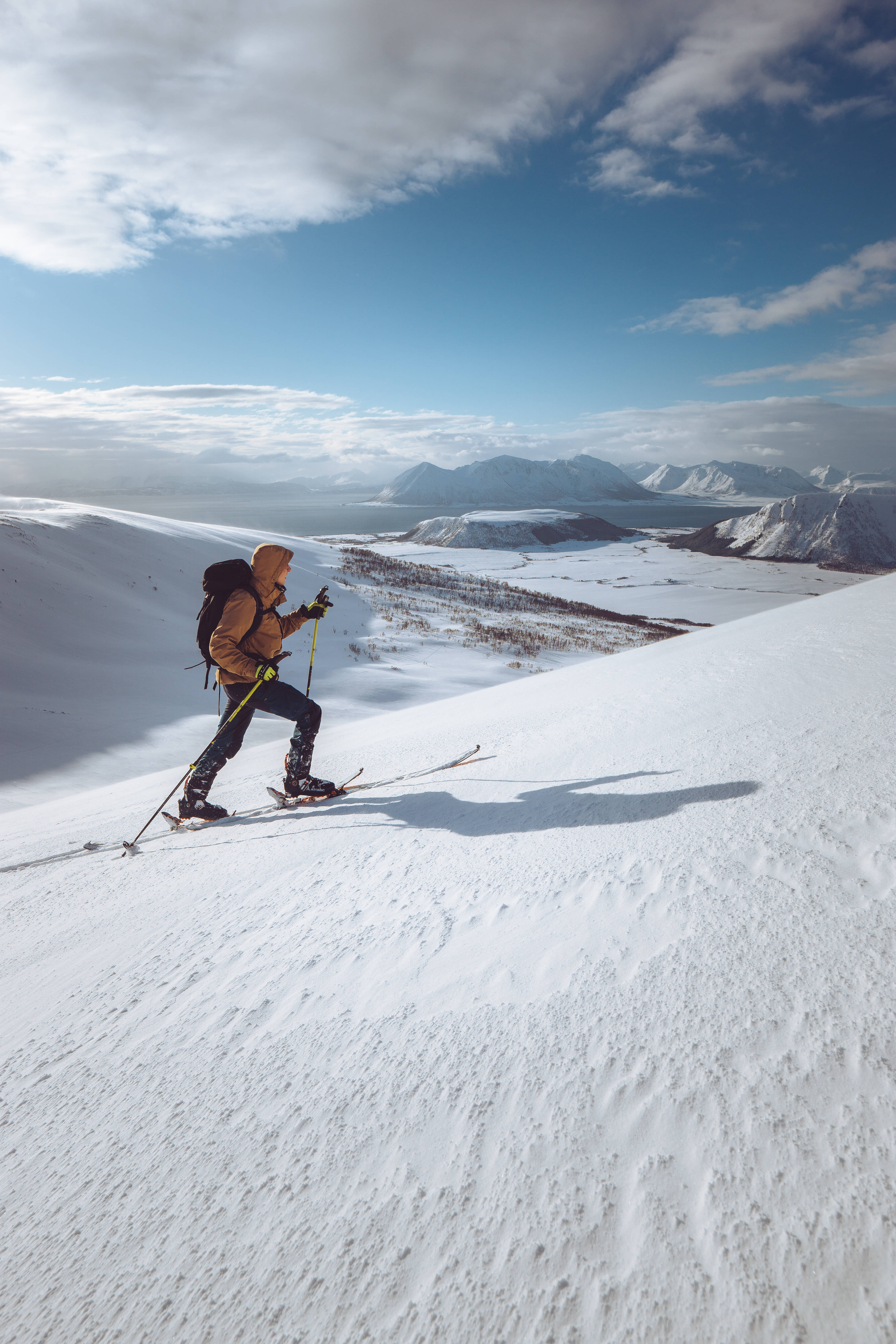 snowy backcountry skiing, snowy mountain slope, bright blue sky, 5K Phone Wallpaper