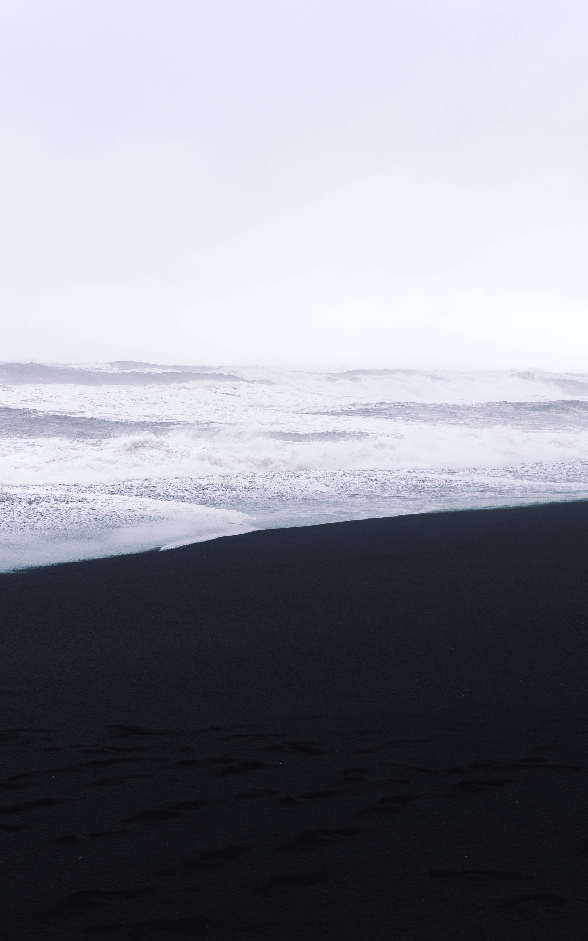 gloomy ocean waves, black sand beach, frothy white waves, 4K Phone Wallpaper