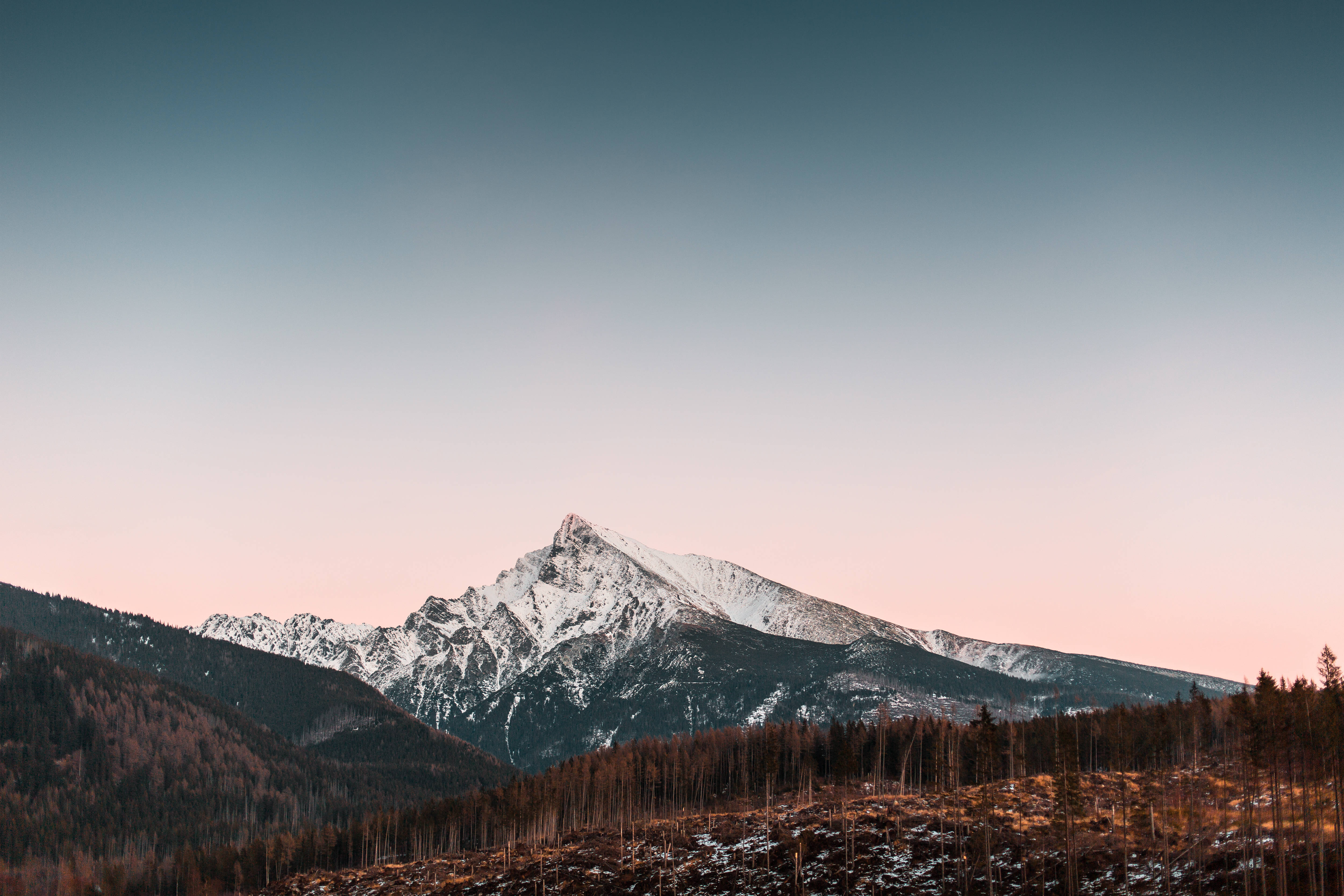 snowy mountain peak, pink and blue twilight sky, forested valley, 4K Desktop Wallpaper