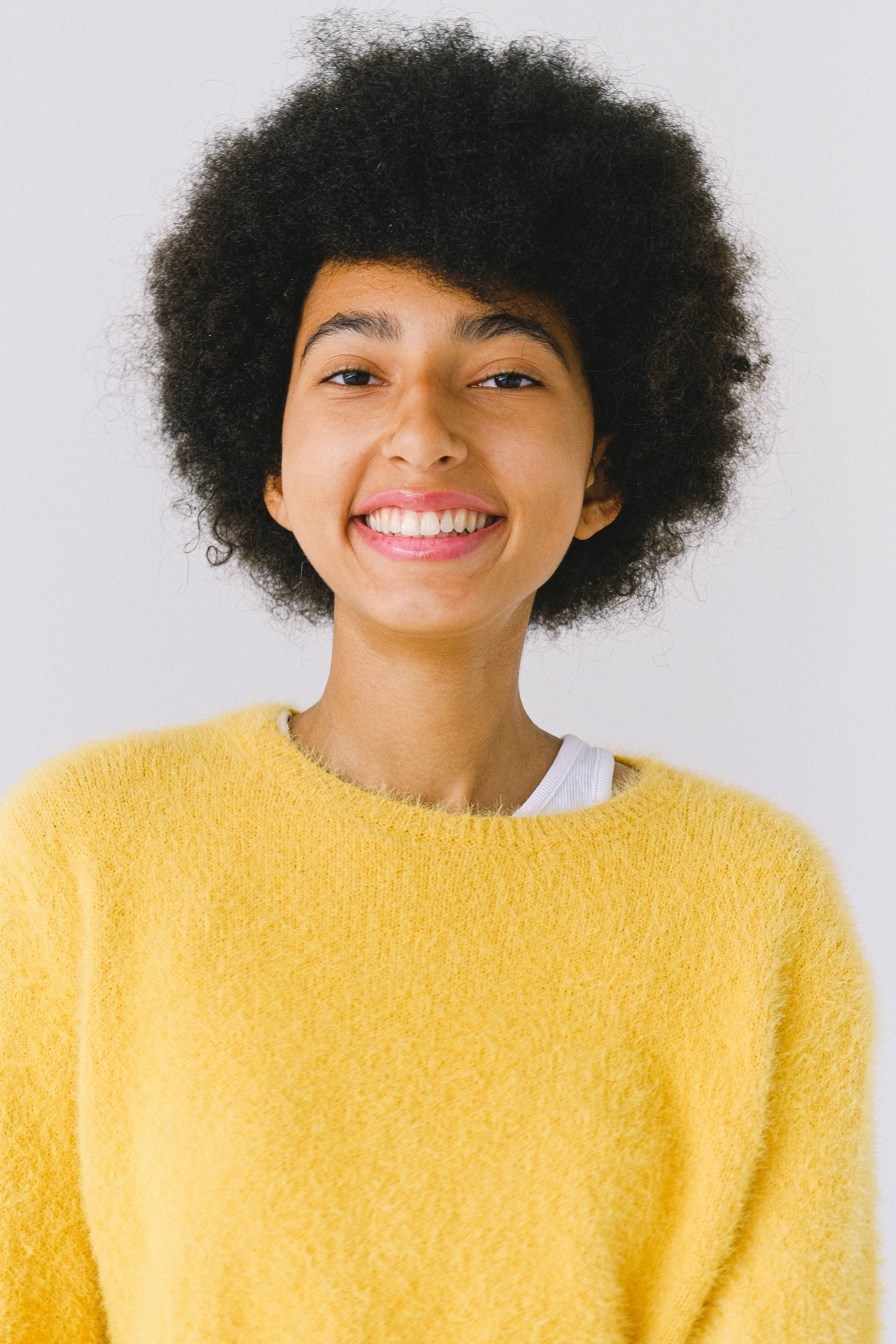 black woman, yellow knitted top, voluminous afro, 5K Phone Wallpaper