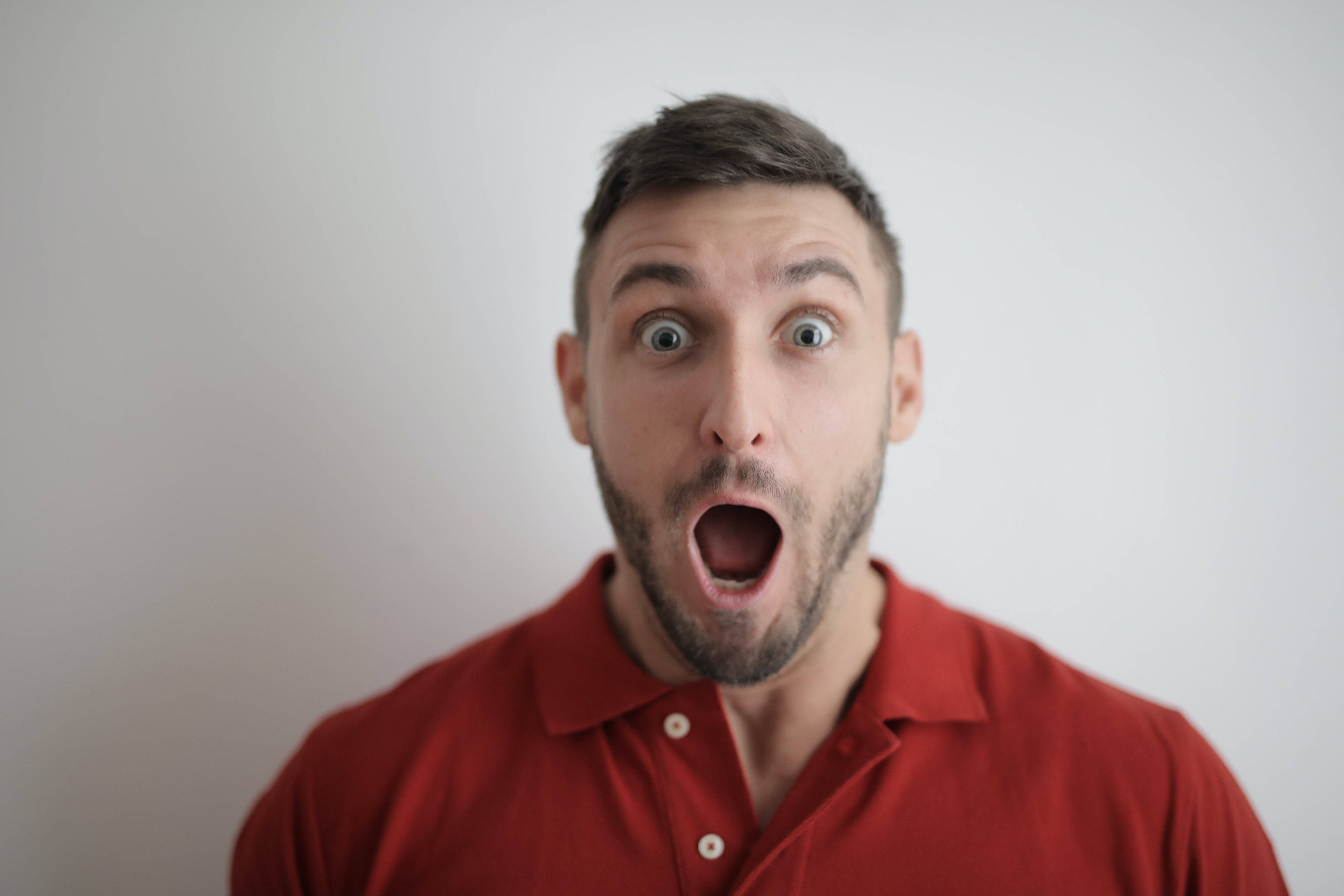 man, red polo shirt, wide eyes, 8K Desktop Wallpaper