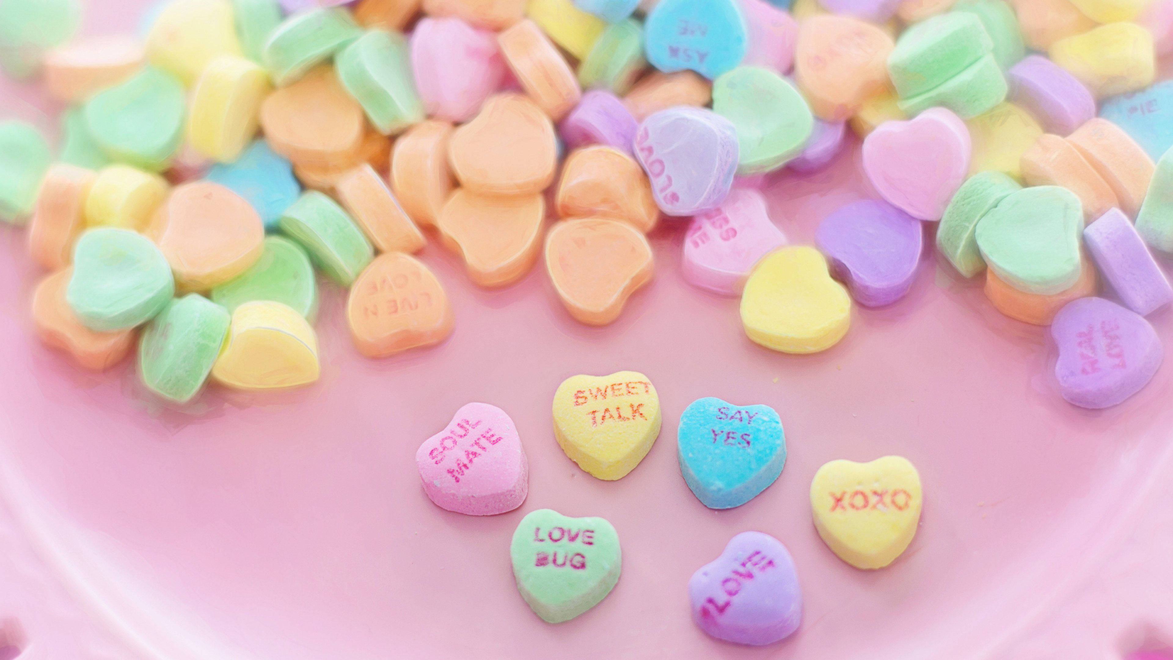 Heart Aesthetic, pastel heart-shaped candies, pink surface, 4K Desktop Wallpaper