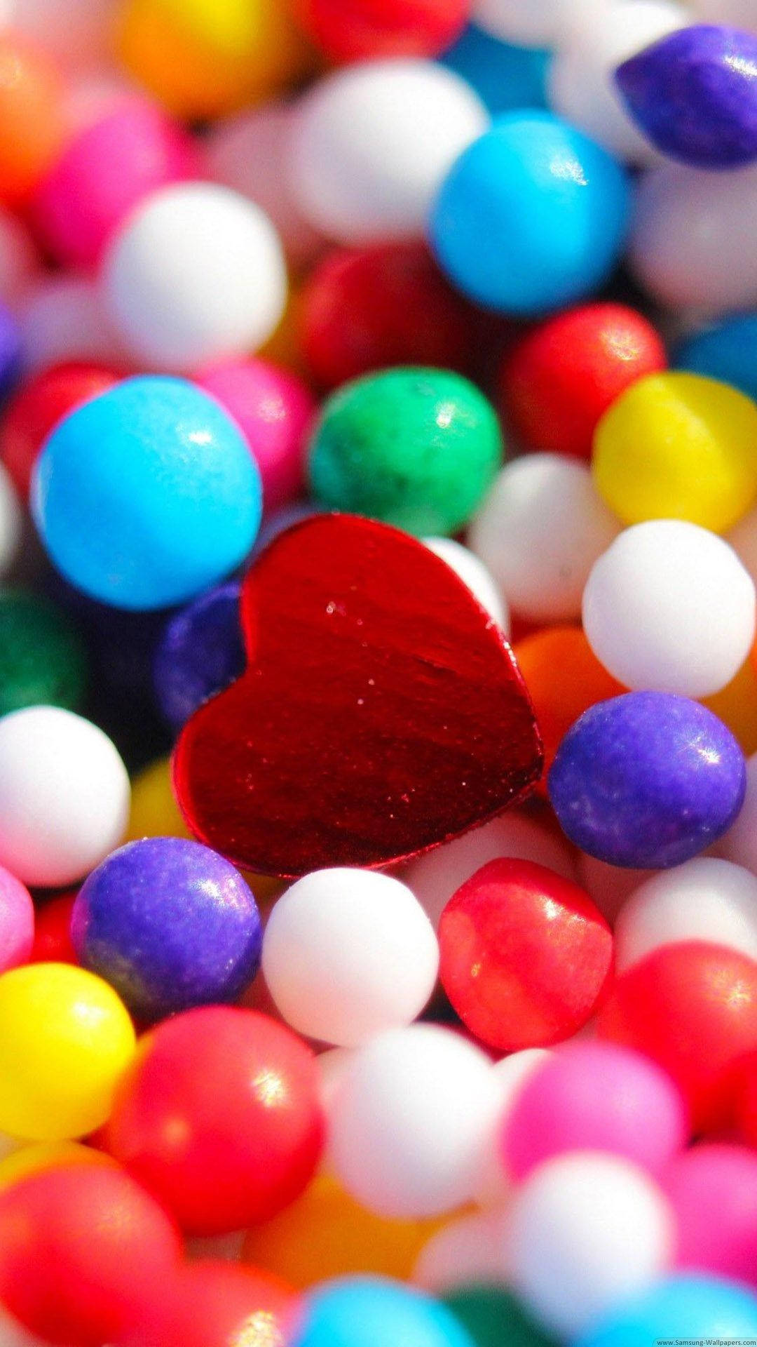 Heart iPhone, glossy red heart, colorful round candies, Full HD Phone Wallpaper