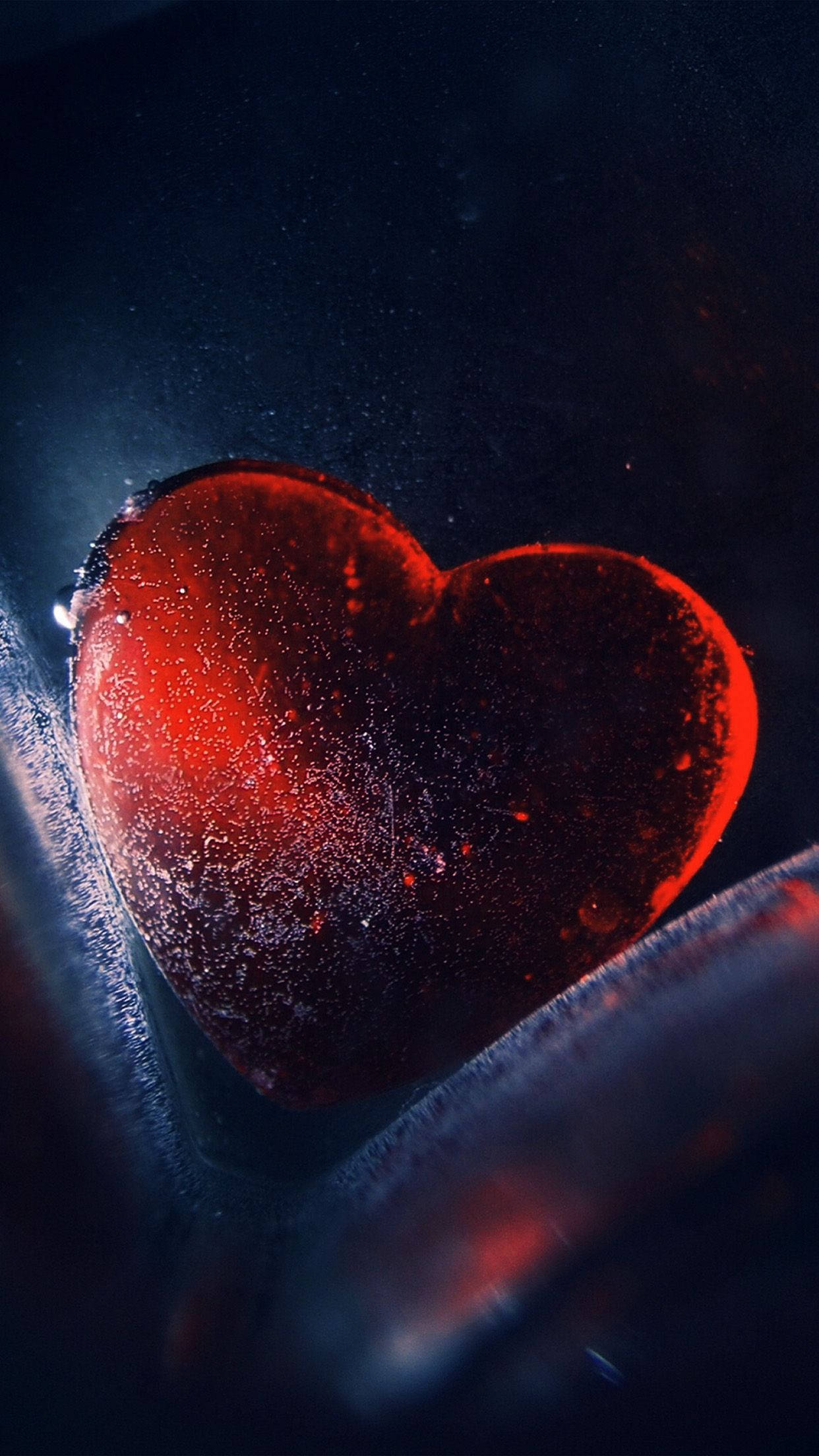 Heart iPhone, glowing red heart-shaped ice formation, dark icy background, Full HD Phone Wallpaper
