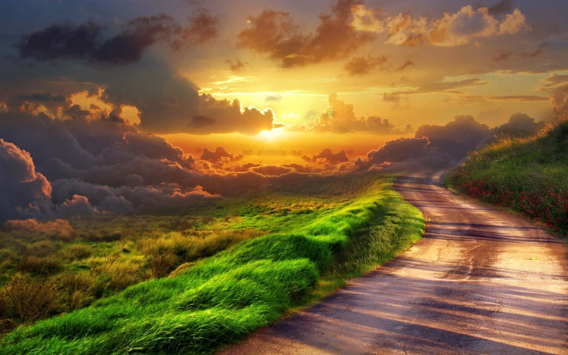 winding road, vibrant green fields, dramatic sunset sky, Full HD Desktop Wallpaper