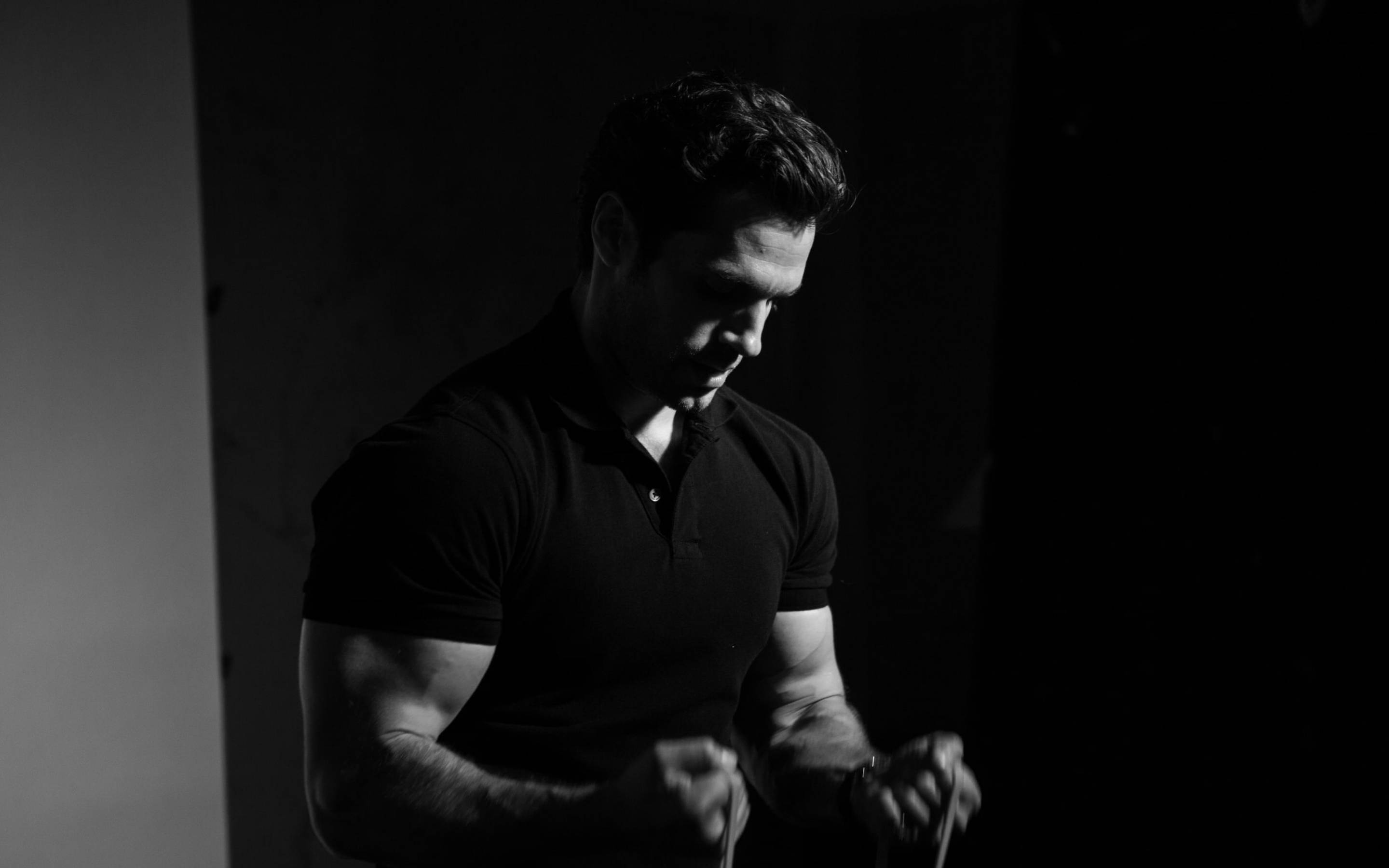 Henry Cavill, black polo shirt, dramatic low-key lighting, 2K Desktop Wallpaper