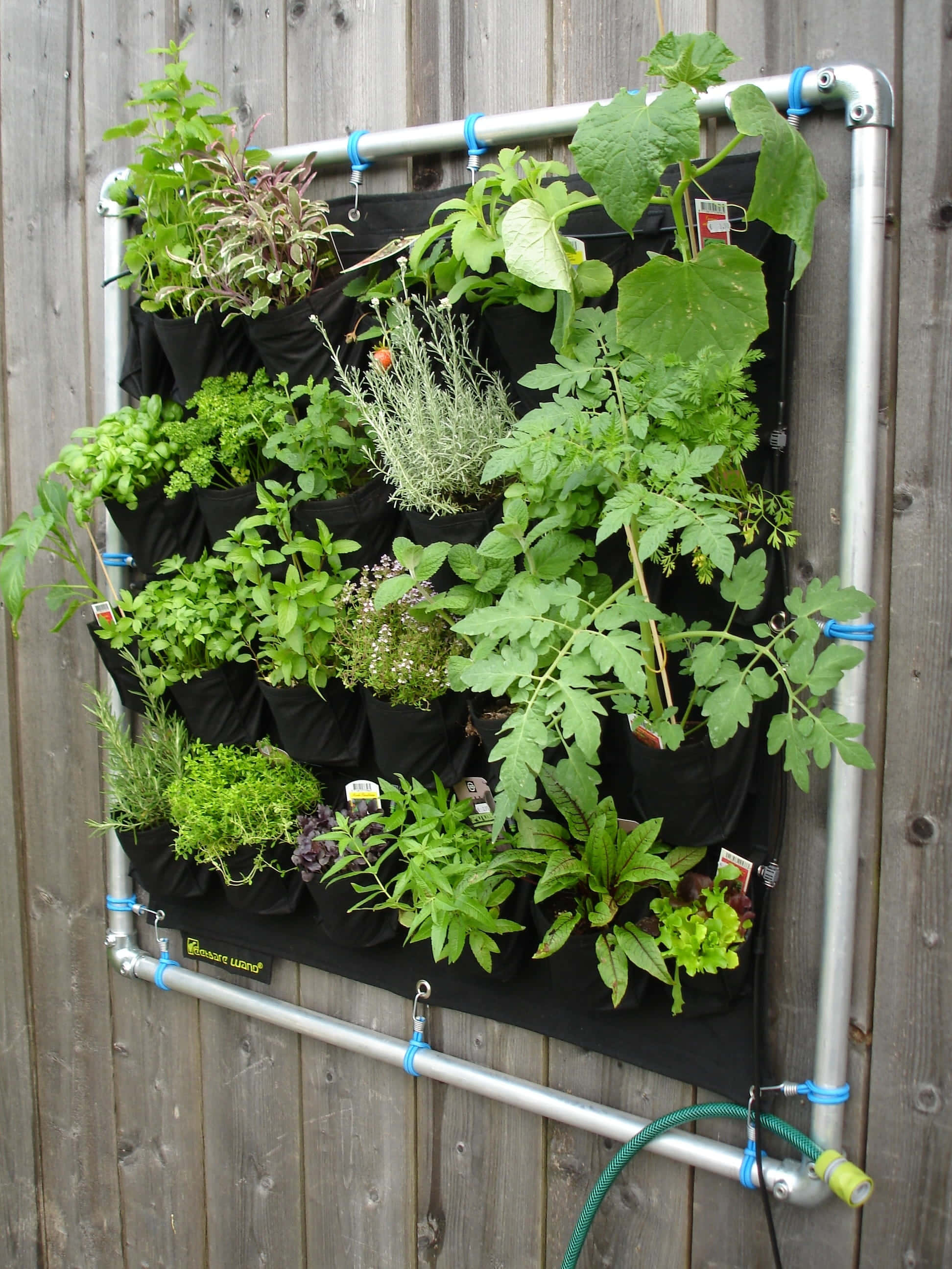 Herb Garden, black fabric pockets, silver pipe frame, 2K Phone Wallpaper