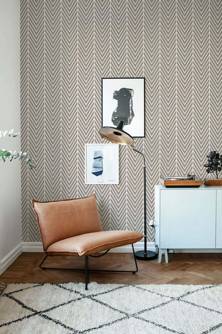 herringbone-patterned wallpaper, tan leather chair, white cabinet, SD Phone Wallpaper