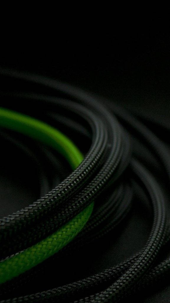 black braided cable, vibrant green stripe, deep shadowy background, SD Phone Wallpaper