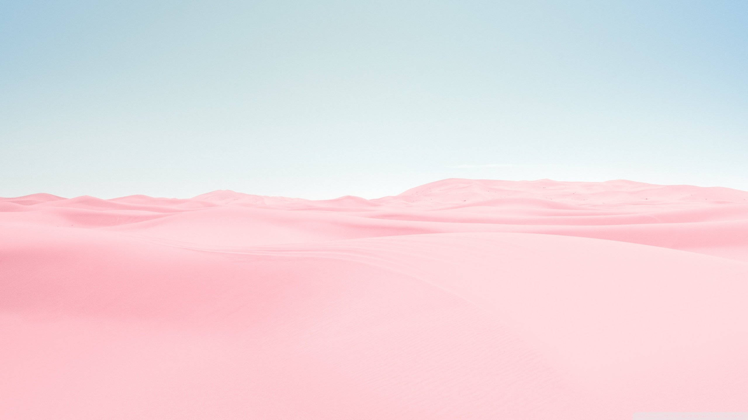 pink desert, soft pink sand dunes, pale blue sky, 2K Desktop Wallpaper