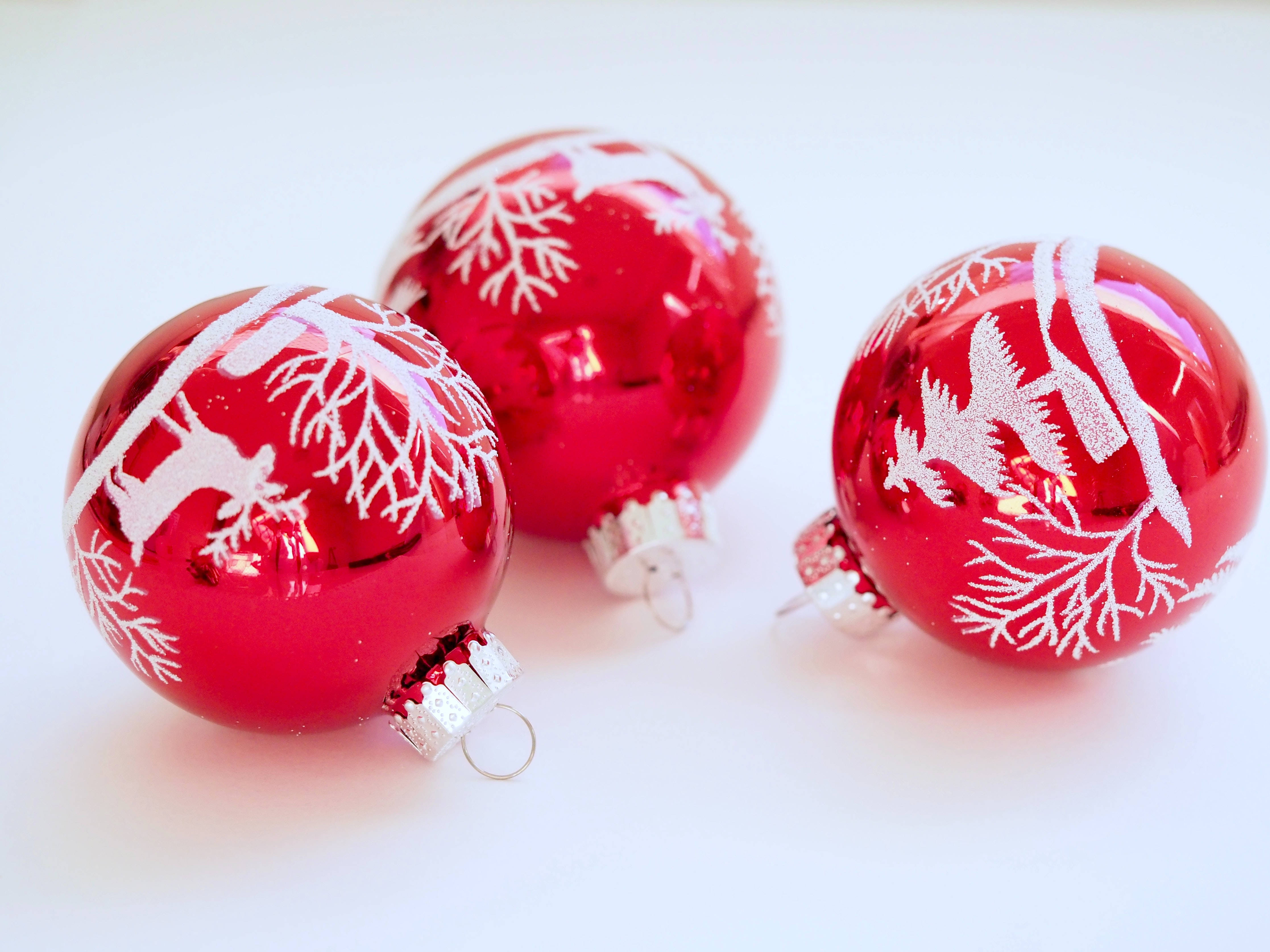 glossy red Christmas ornaments, white snowflake designs, reindeer designs, 4K Desktop Wallpaper