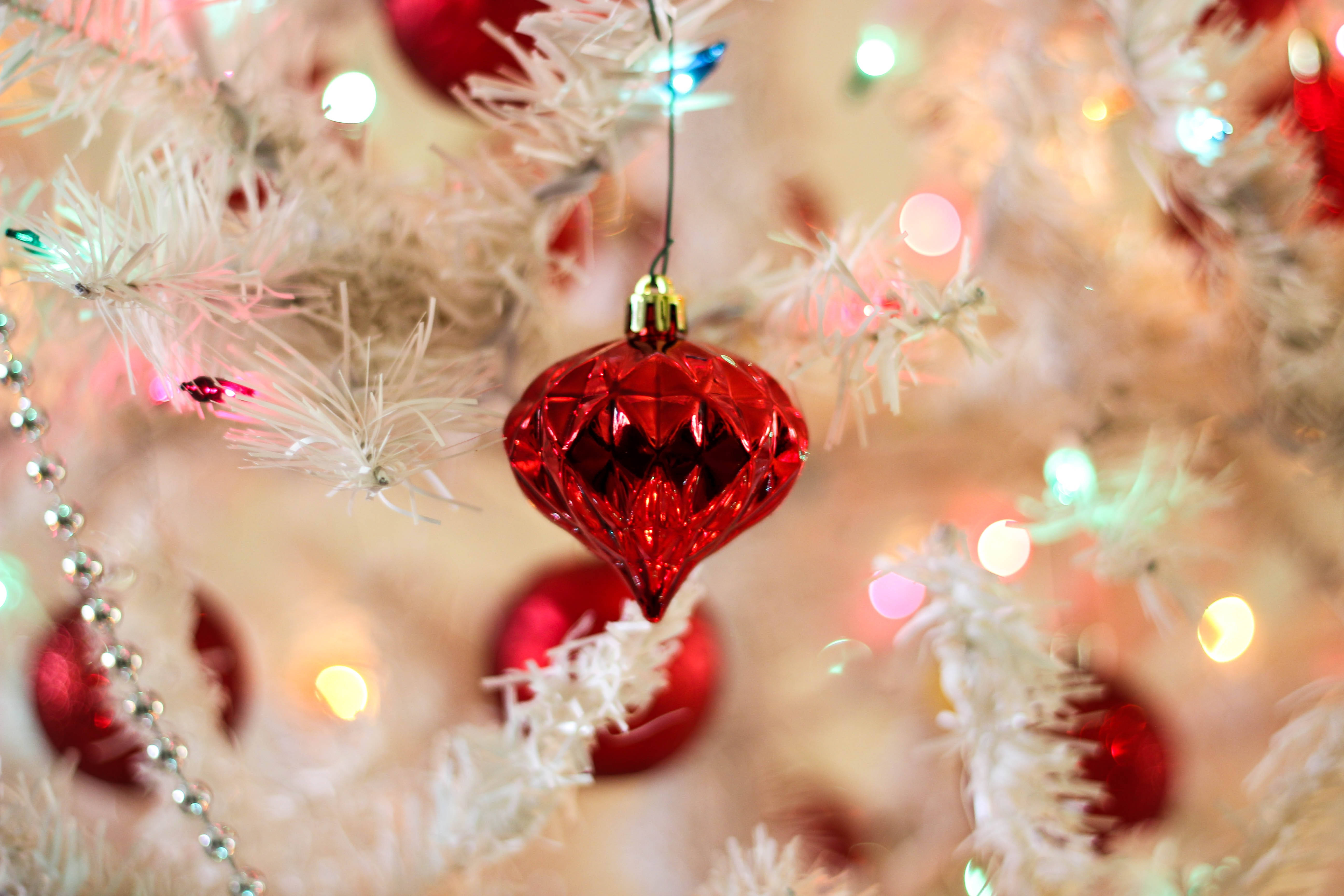red glass ornament, white Christmas tree, twinkling colorful lights, 5K Desktop Wallpaper