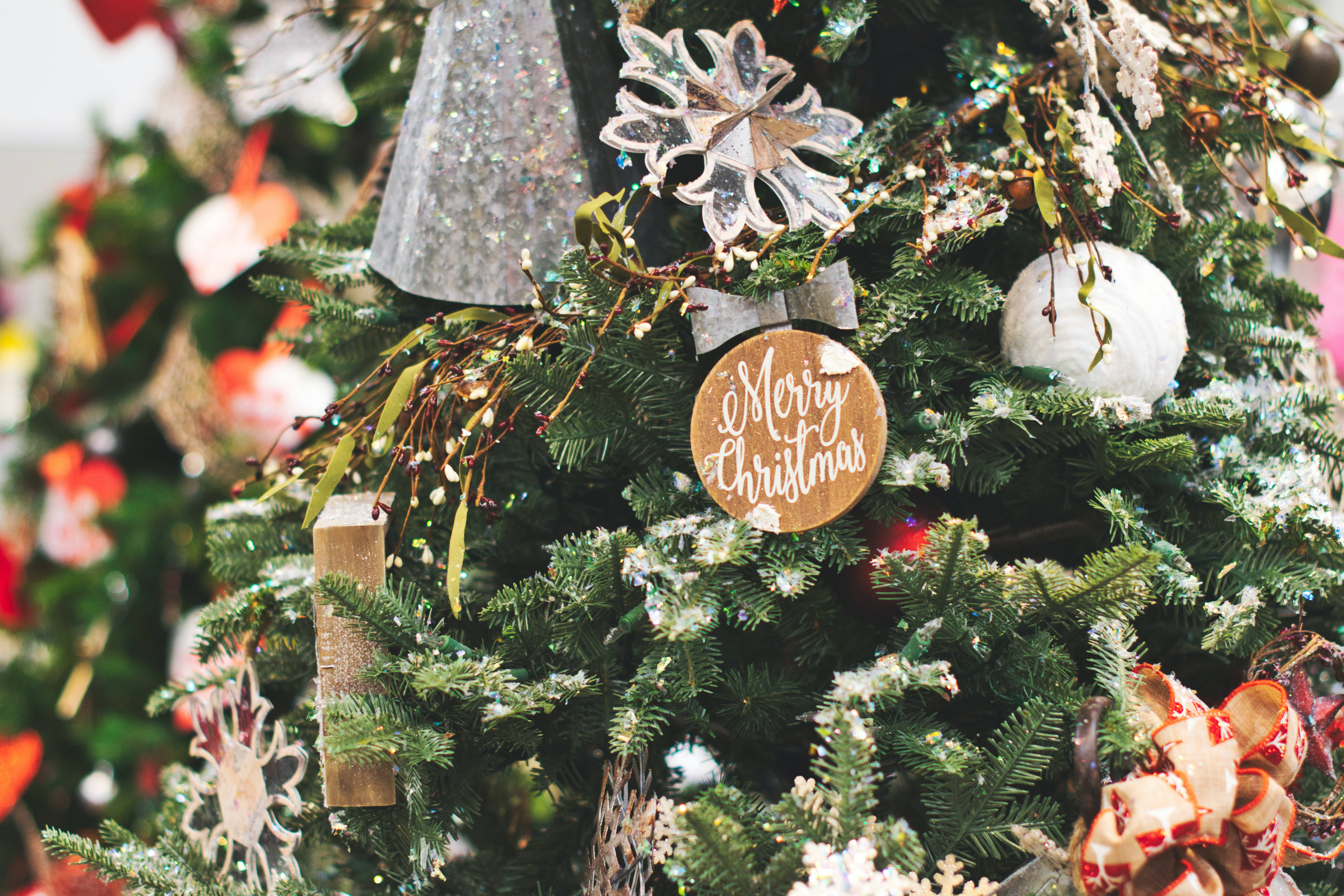 Christmas tree, glittering snowflake ornaments, wooden 'Merry Christmas' sign, 5K Desktop Wallpaper