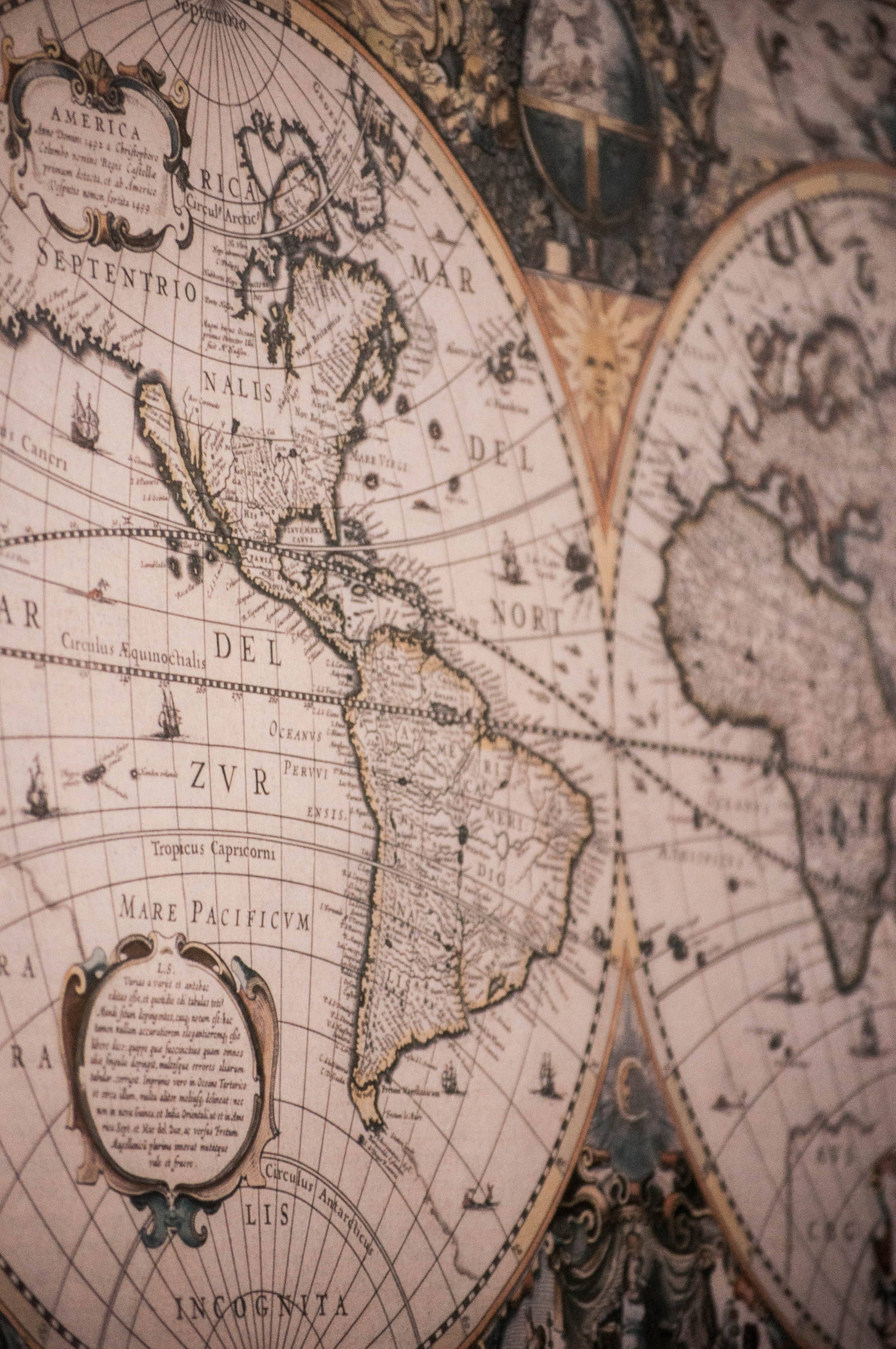 antique world map, intricate details, faded sepia tones, 4K Phone Wallpaper