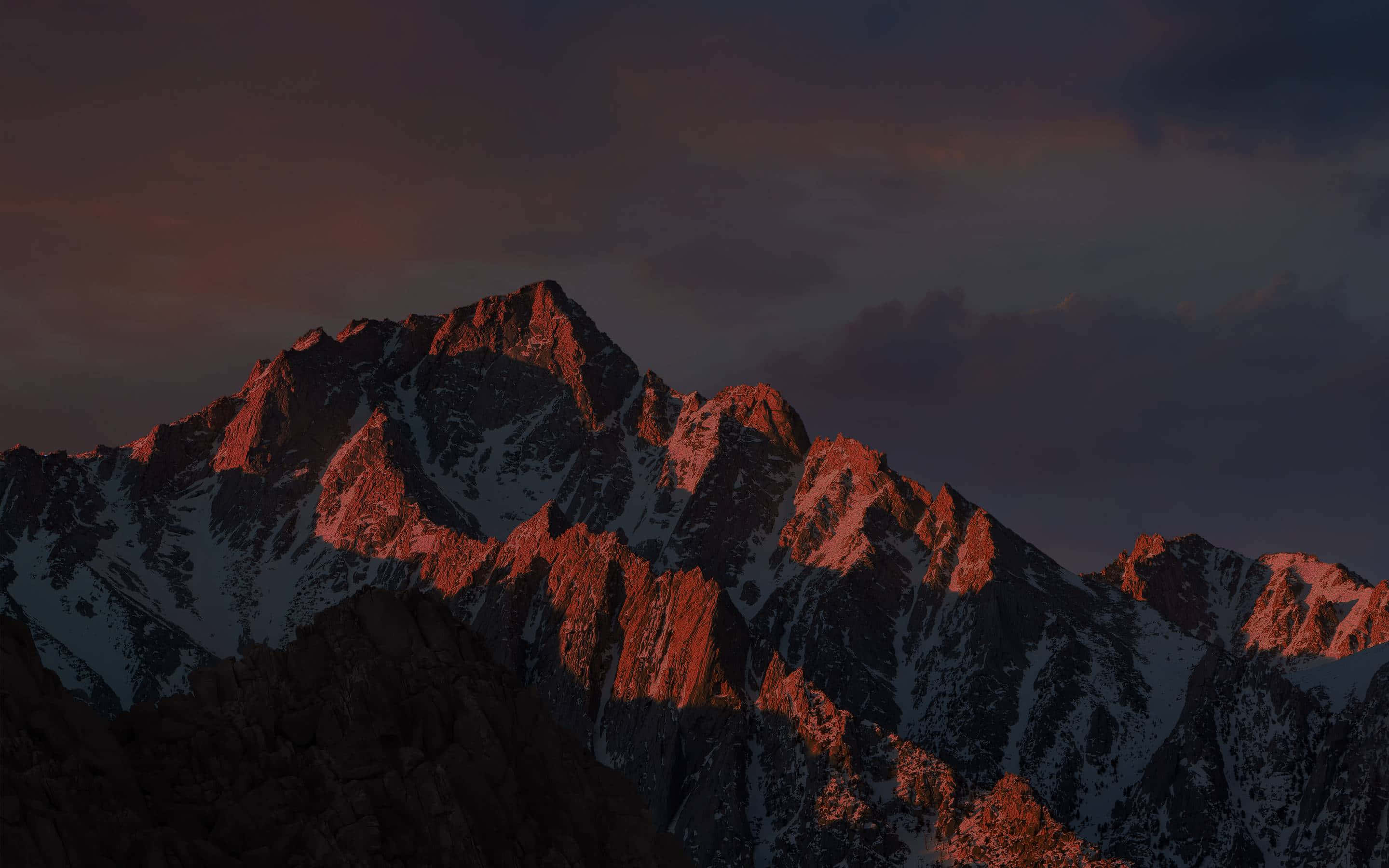 High Sierra, snowcapped mountain range, warm sunset glow, 2K Desktop Wallpaper