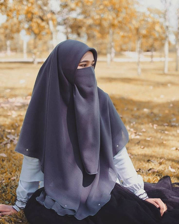 dark grey niqab, golden autumn trees, soft sunlight, SD Phone Wallpaper