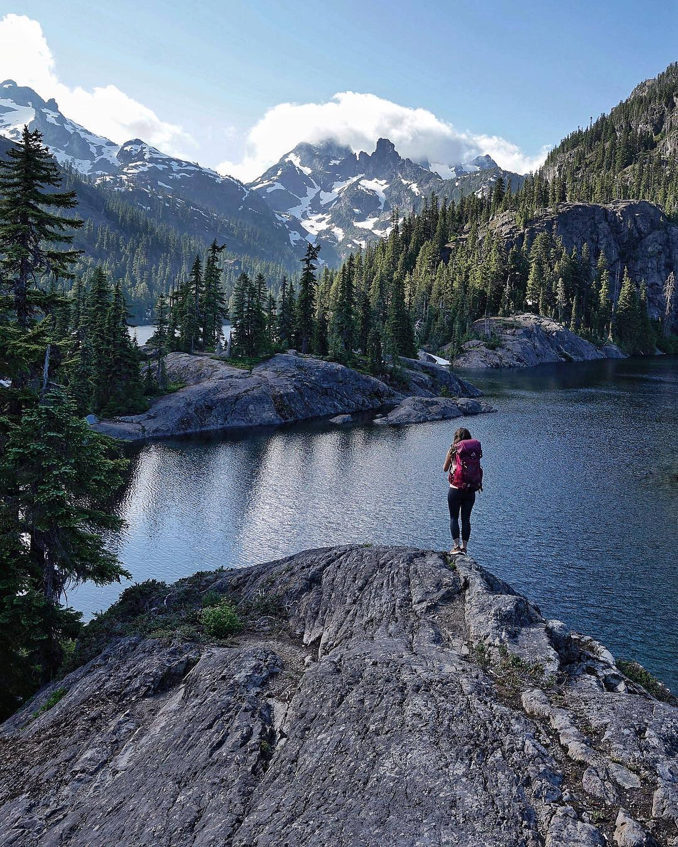 red backpack, rocky outcrop, alpine lake, 2K Phone Wallpaper