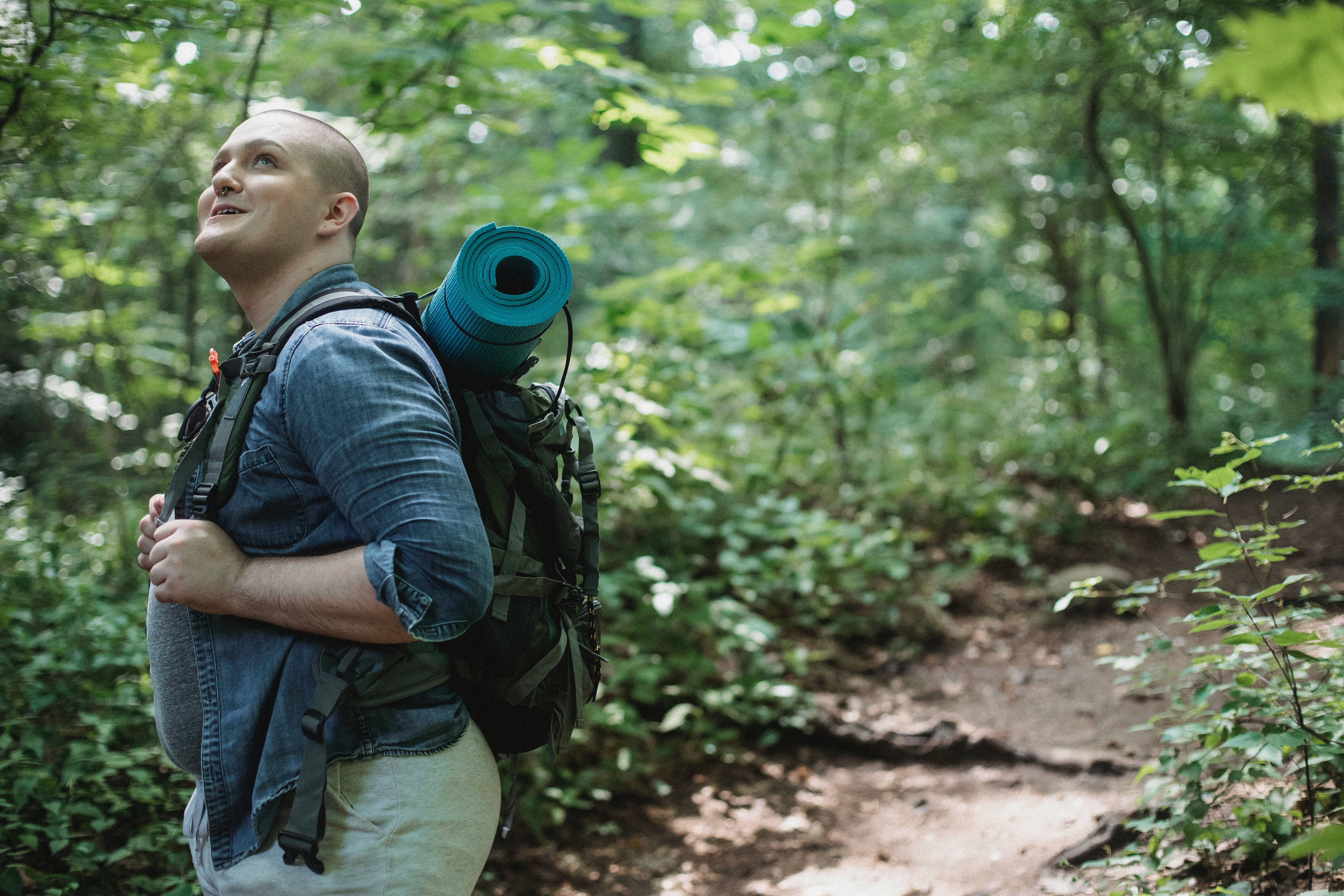 bald hiker, teal sleeping pad, sun-dappled forest trail, 5K Desktop Wallpaper