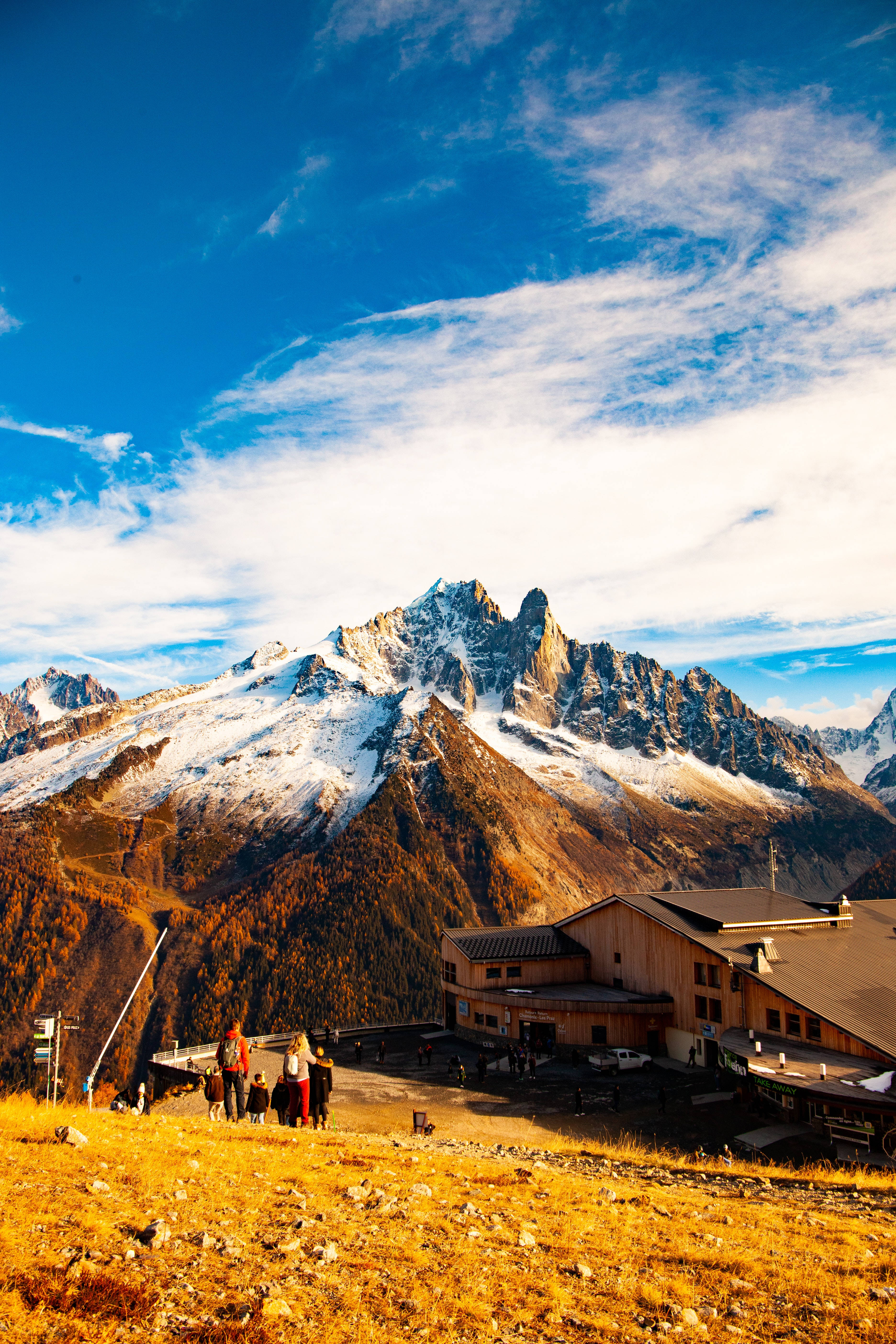 snowy hill view, golden hillside, snow-capped mountain range, 5K Phone Wallpaper