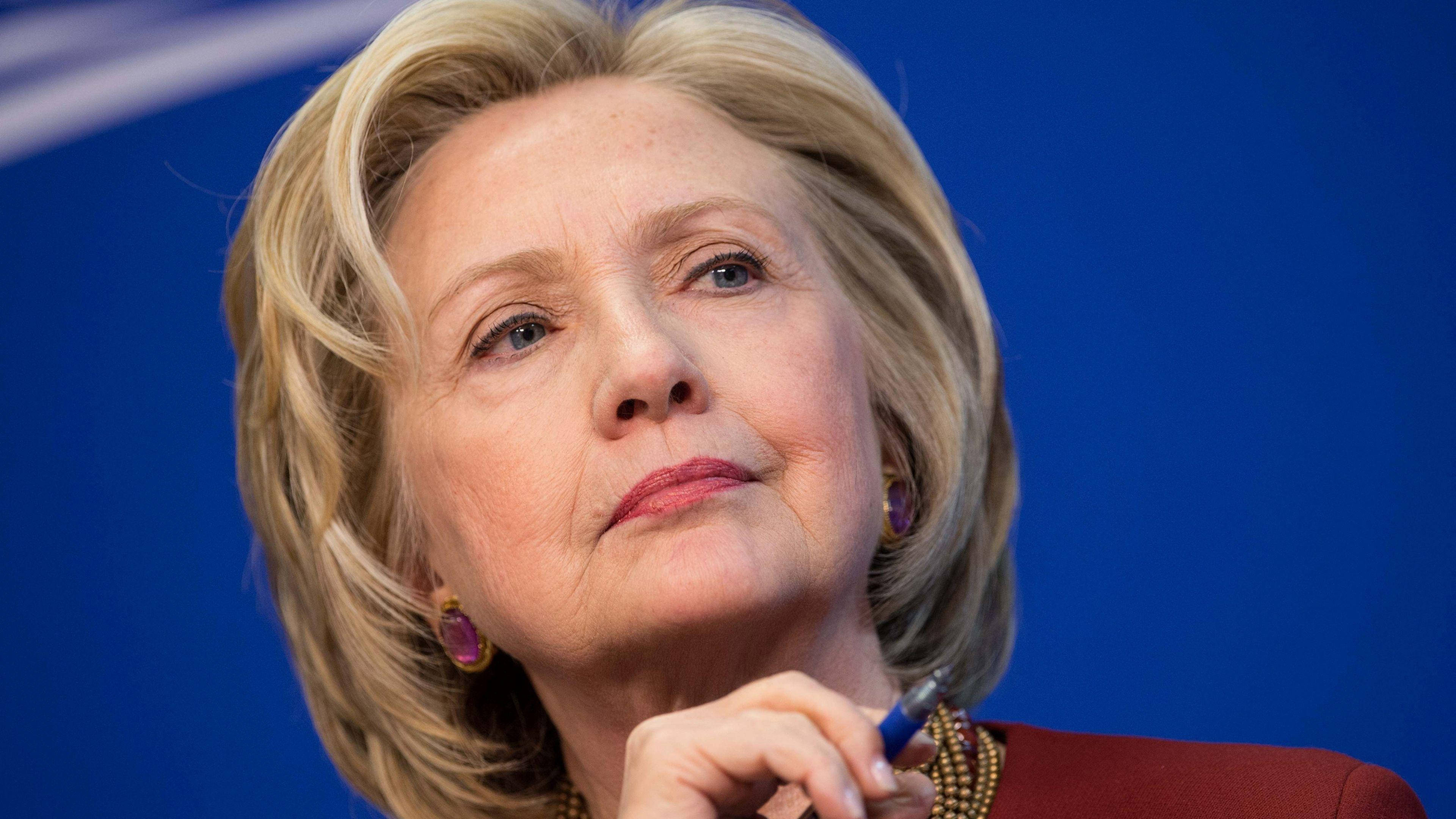 Hillary Clinton, close-up portrait, solid blue background, 4K Desktop Wallpaper