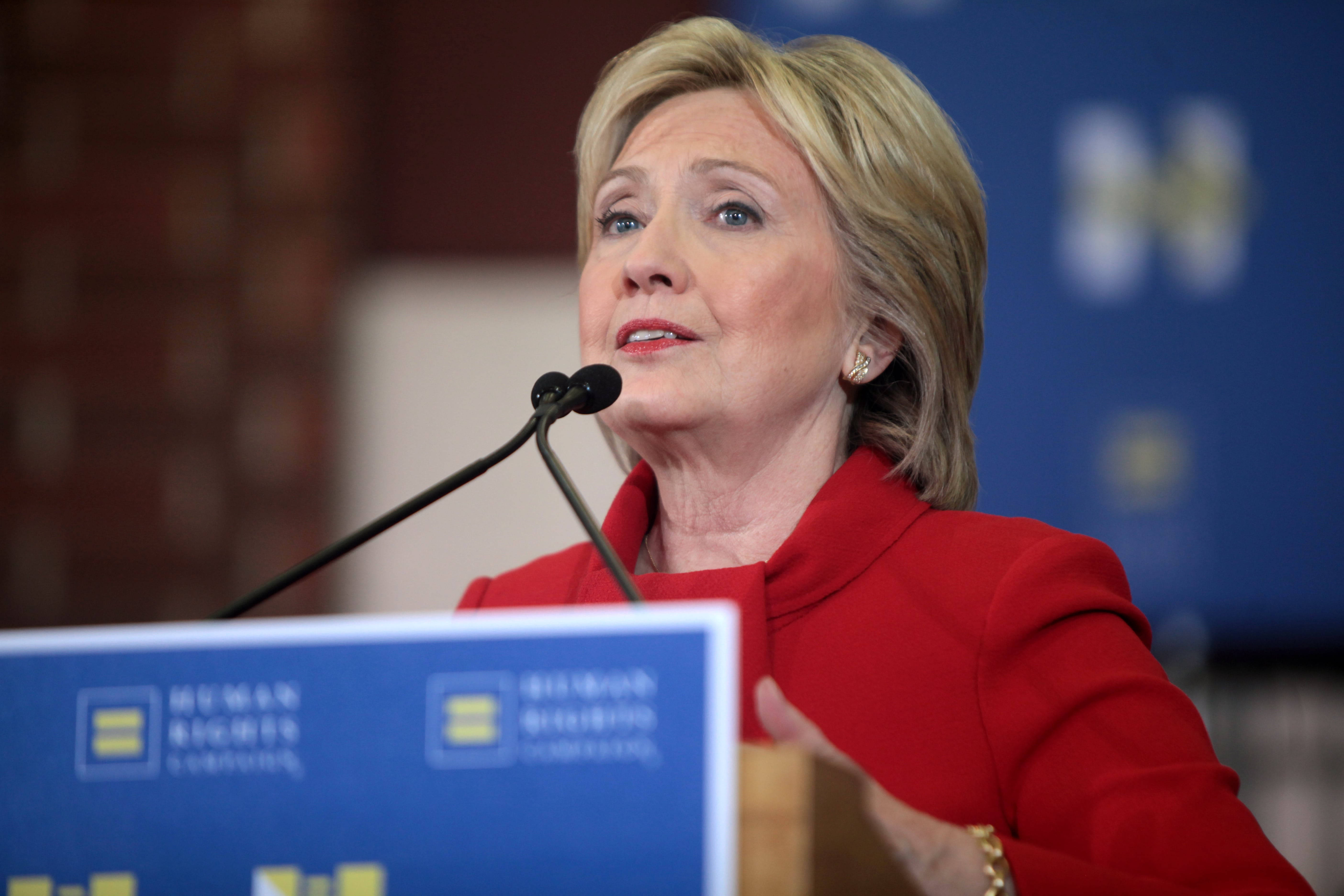 Hillary Clinton, bold red jacket, blue backdrop, 5K Desktop Wallpaper