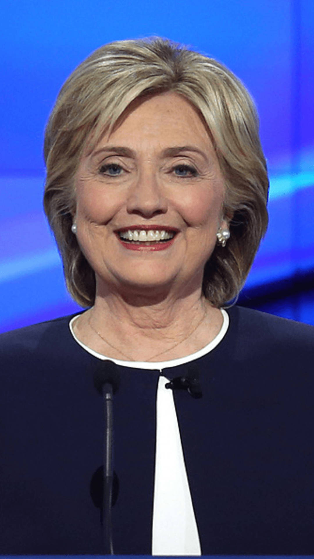 Hillary Clinton, formal smile, podium, Full HD Phone Wallpaper