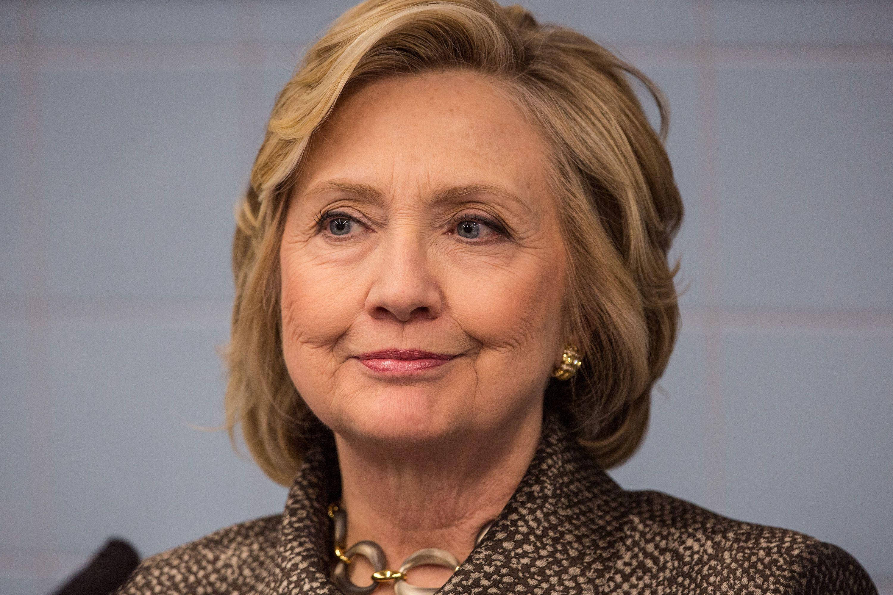 Hillary Clinton, half smile, patterned jacket, 2K Desktop Wallpaper