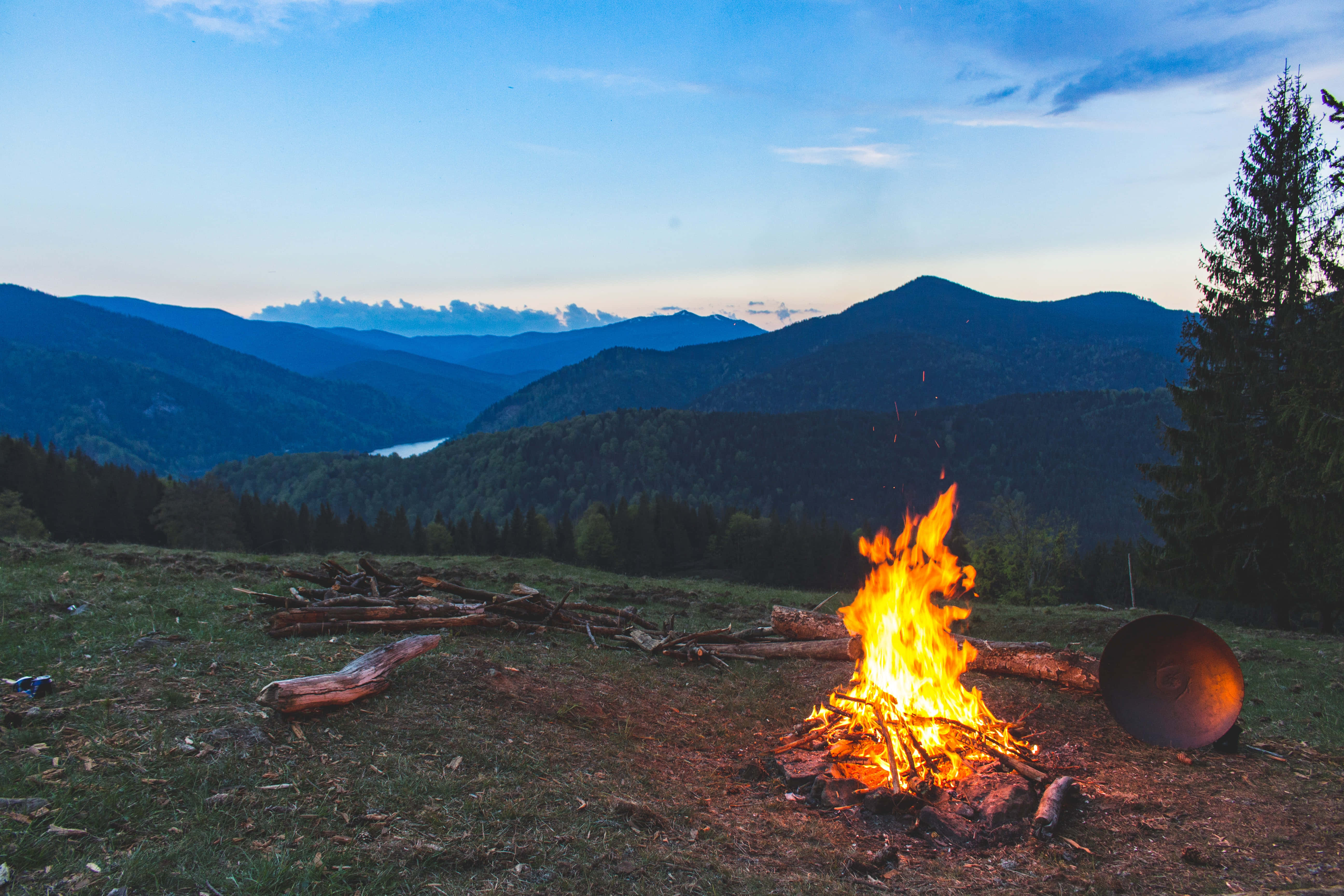 campfire, grassy hillside, dusk, 5K Desktop Wallpaper