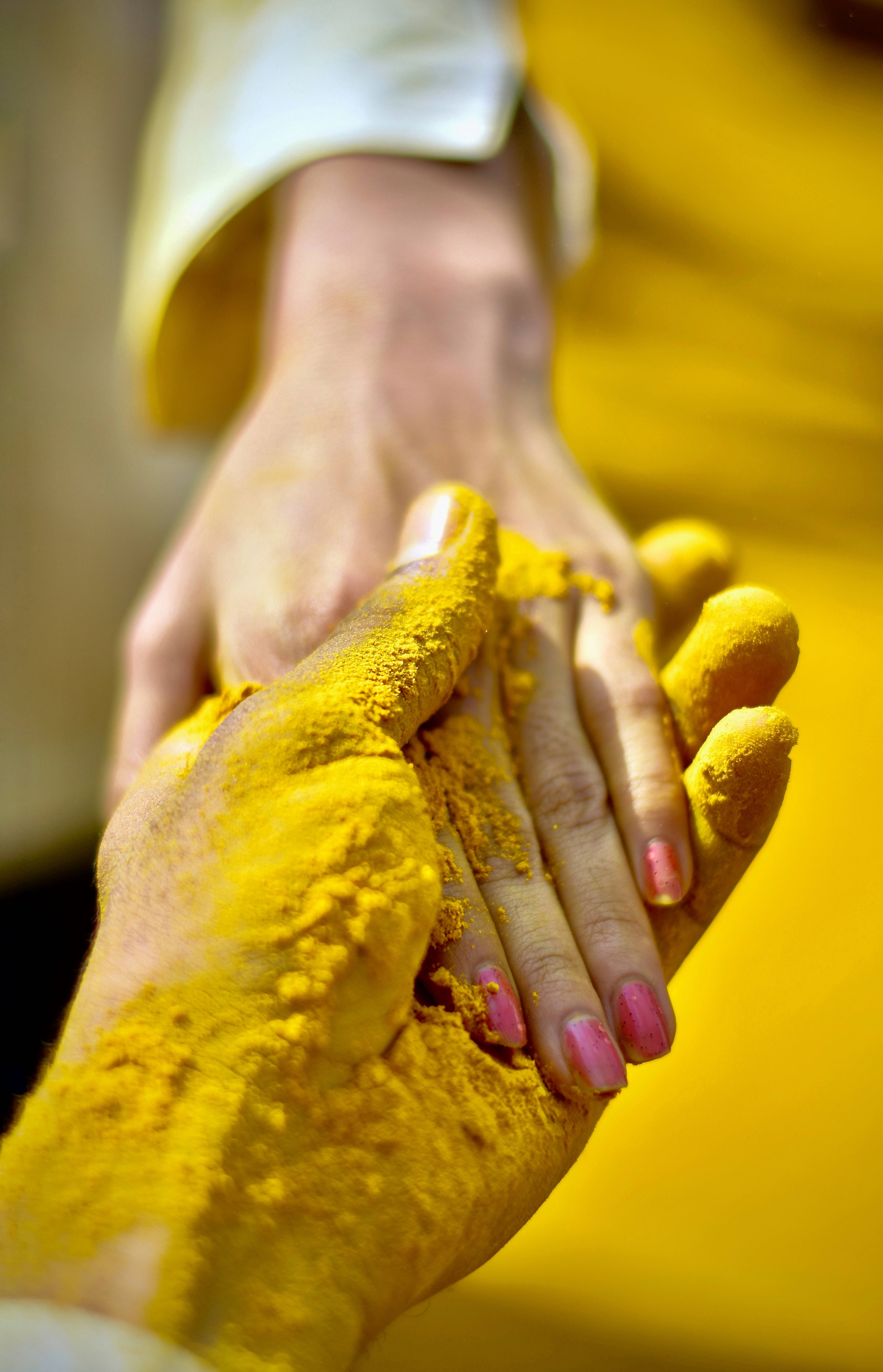 yellow powder, pink nail polish, warm yellow background, 5K Phone Wallpaper
