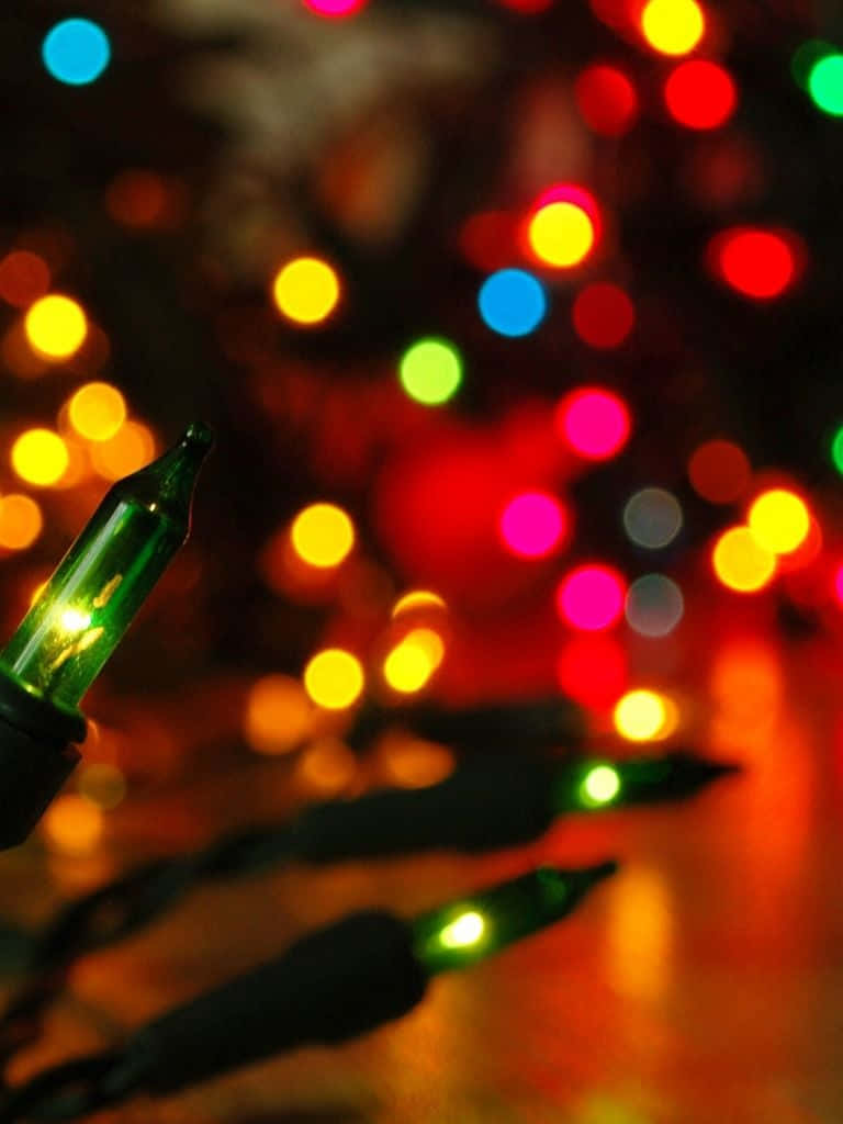 iPhone, glowing green string lights, colorful bokeh, SD Phone Wallpaper