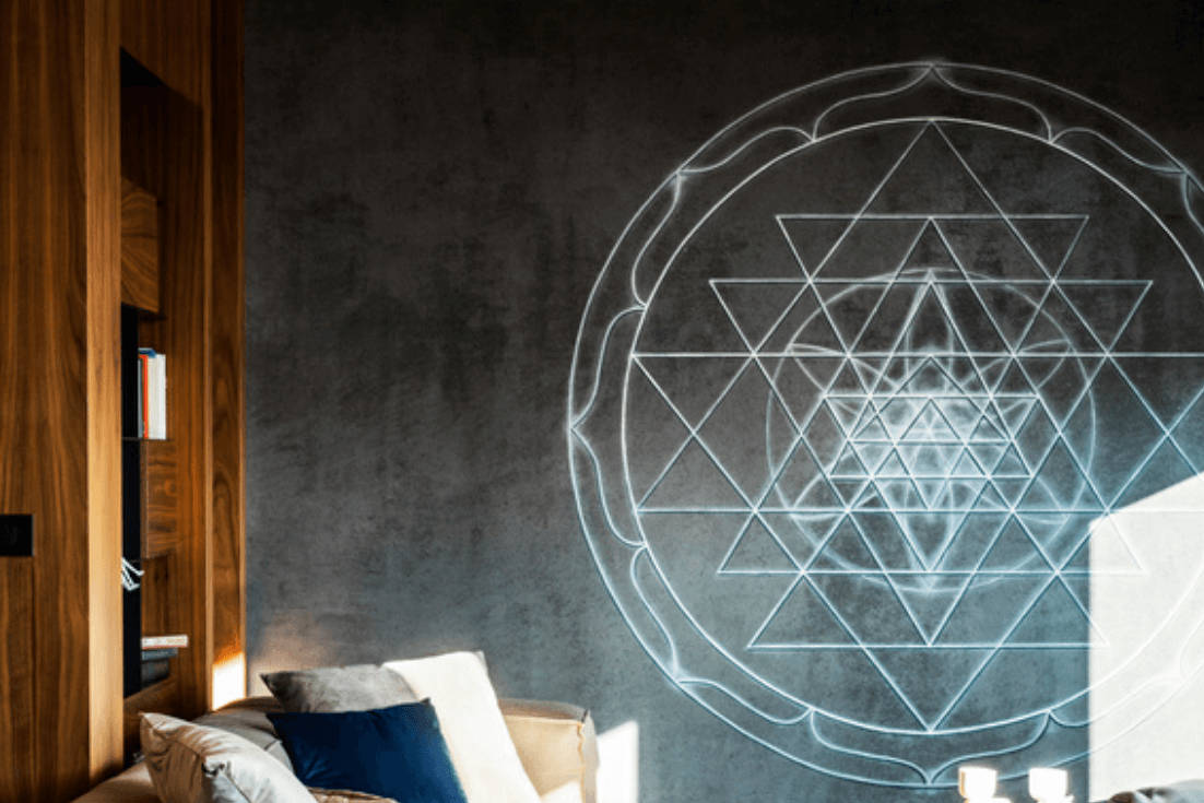 geometric mandala projection, dark textured wall, cozy sofa, SD Desktop Wallpaper