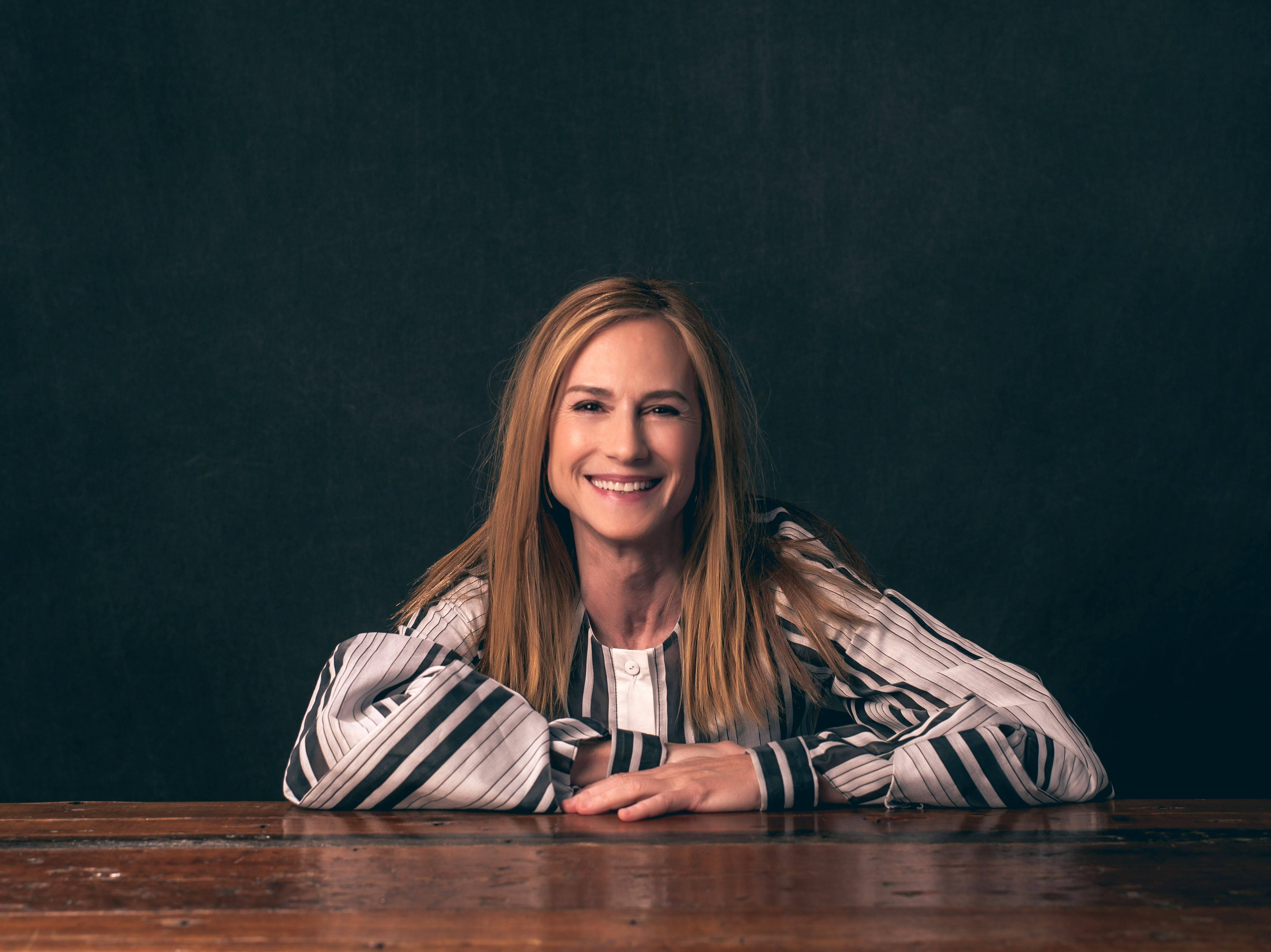 Holly Hunter, long blonde hair, wooden table, 5K Desktop Wallpaper