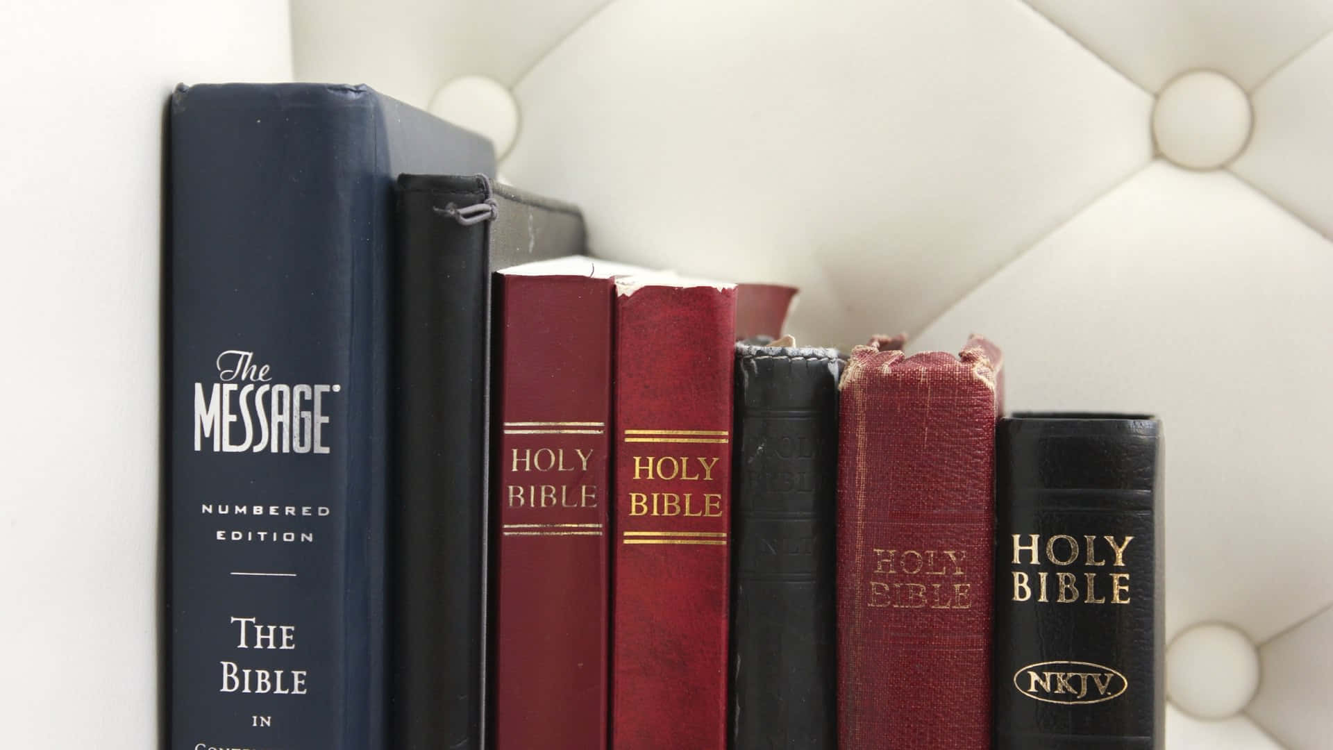 Holy Bible, white tufted headboard, serene bedroom setting, Full HD Desktop Wallpaper