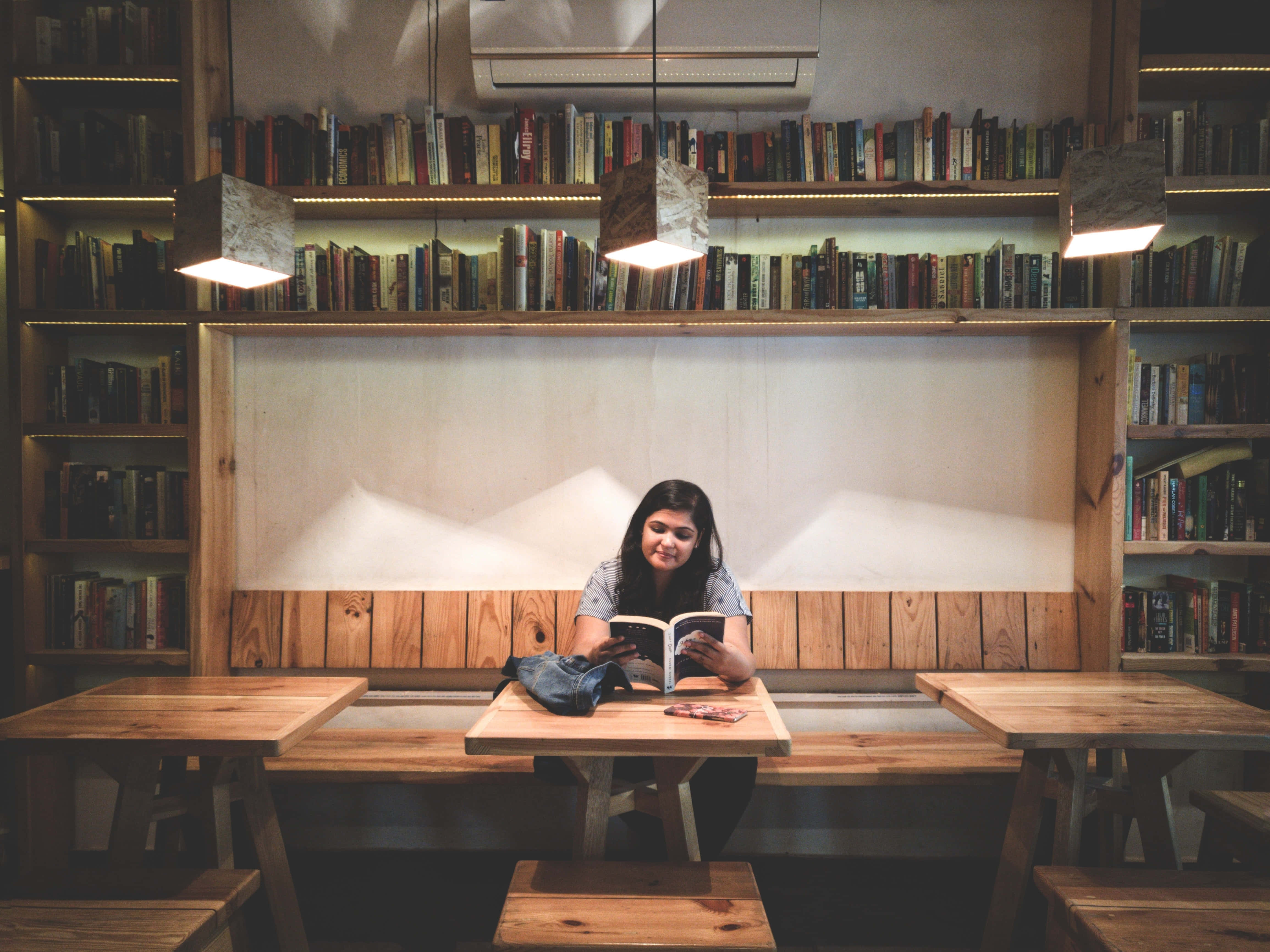 Home Library, wooden table, tall bookshelves, 4K Desktop Wallpaper