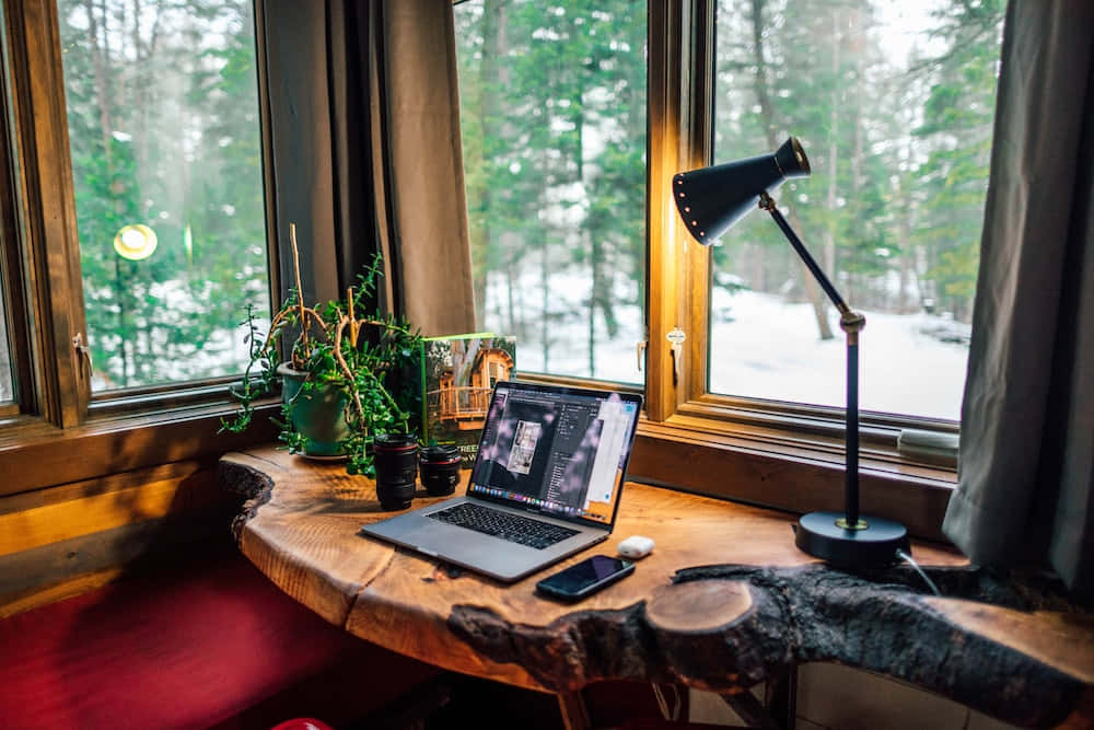 wooden desk, snowy forest window, laptop, SD Desktop Wallpaper
