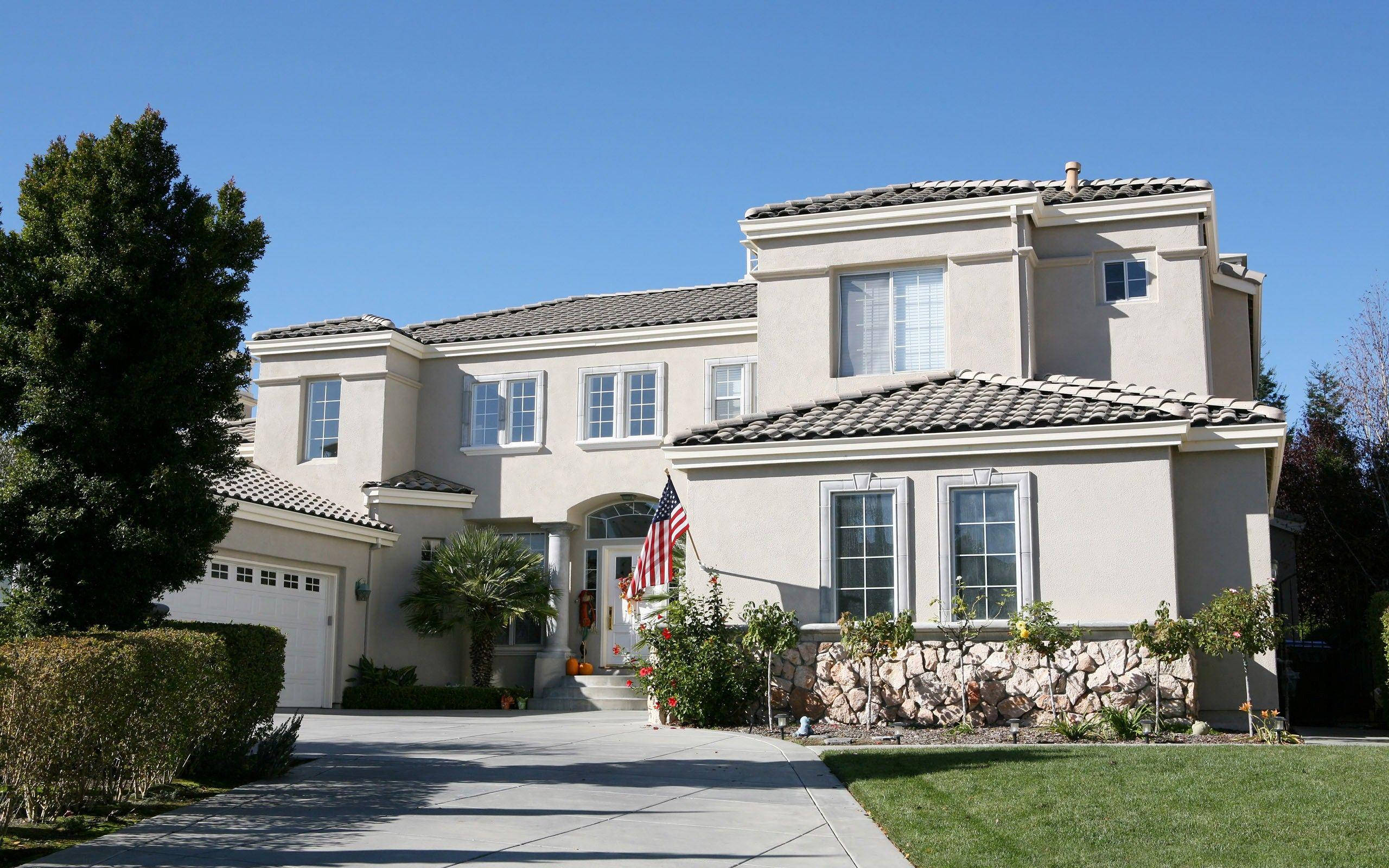 beige stucco house, tiled roof, stone accents, 2K Desktop Wallpaper