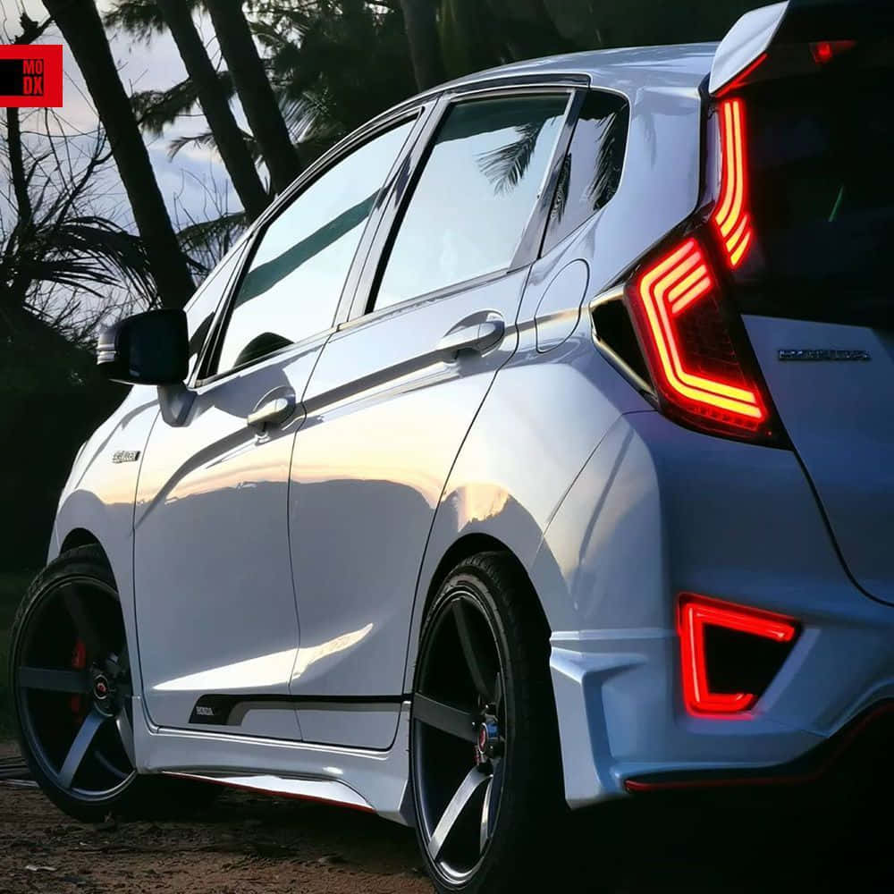Honda Fit, sleek silver, glowing red taillights, SD Desktop Wallpaper