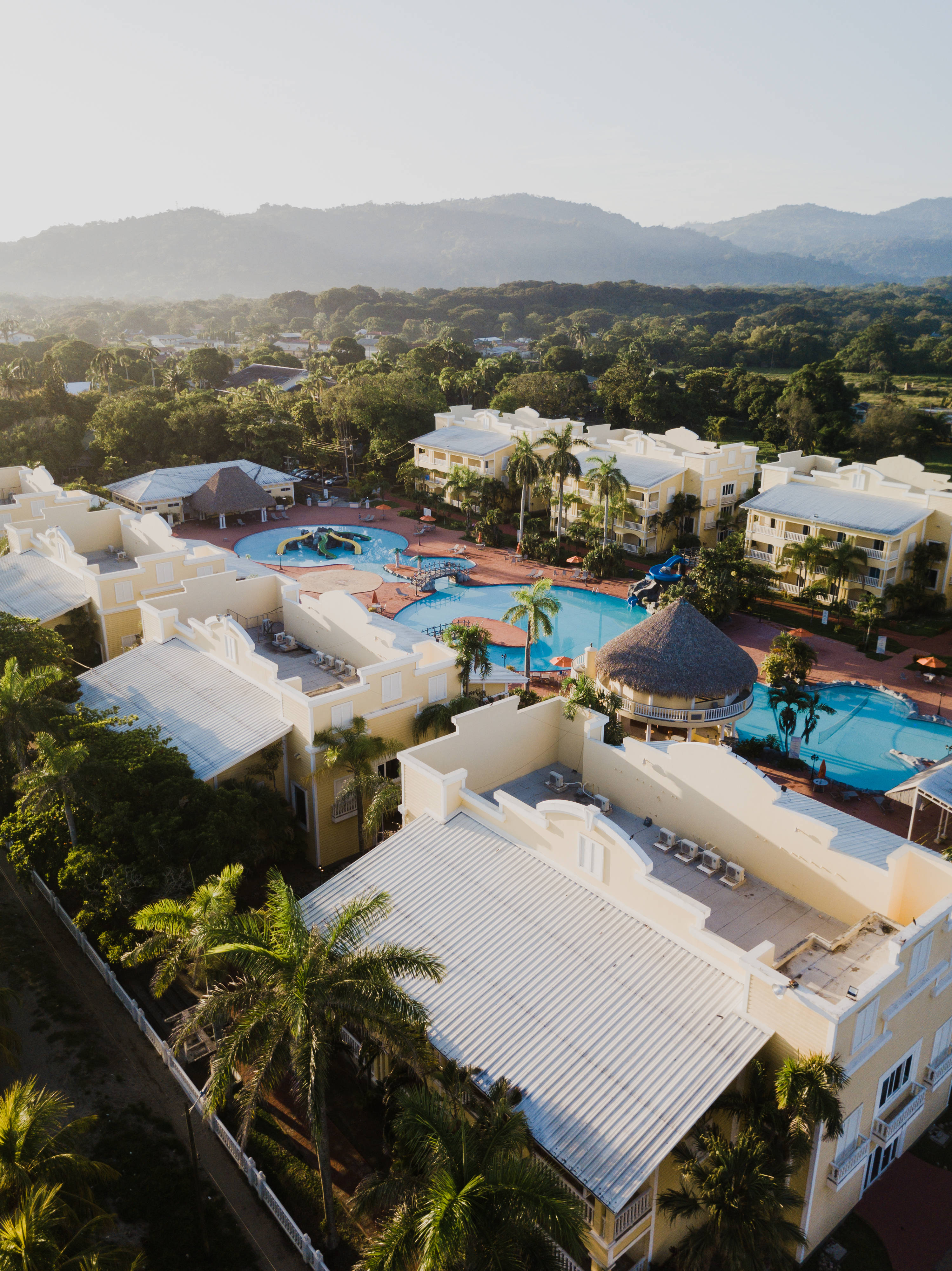 white buildings, palm trees, blue pools, 4K Phone Wallpaper