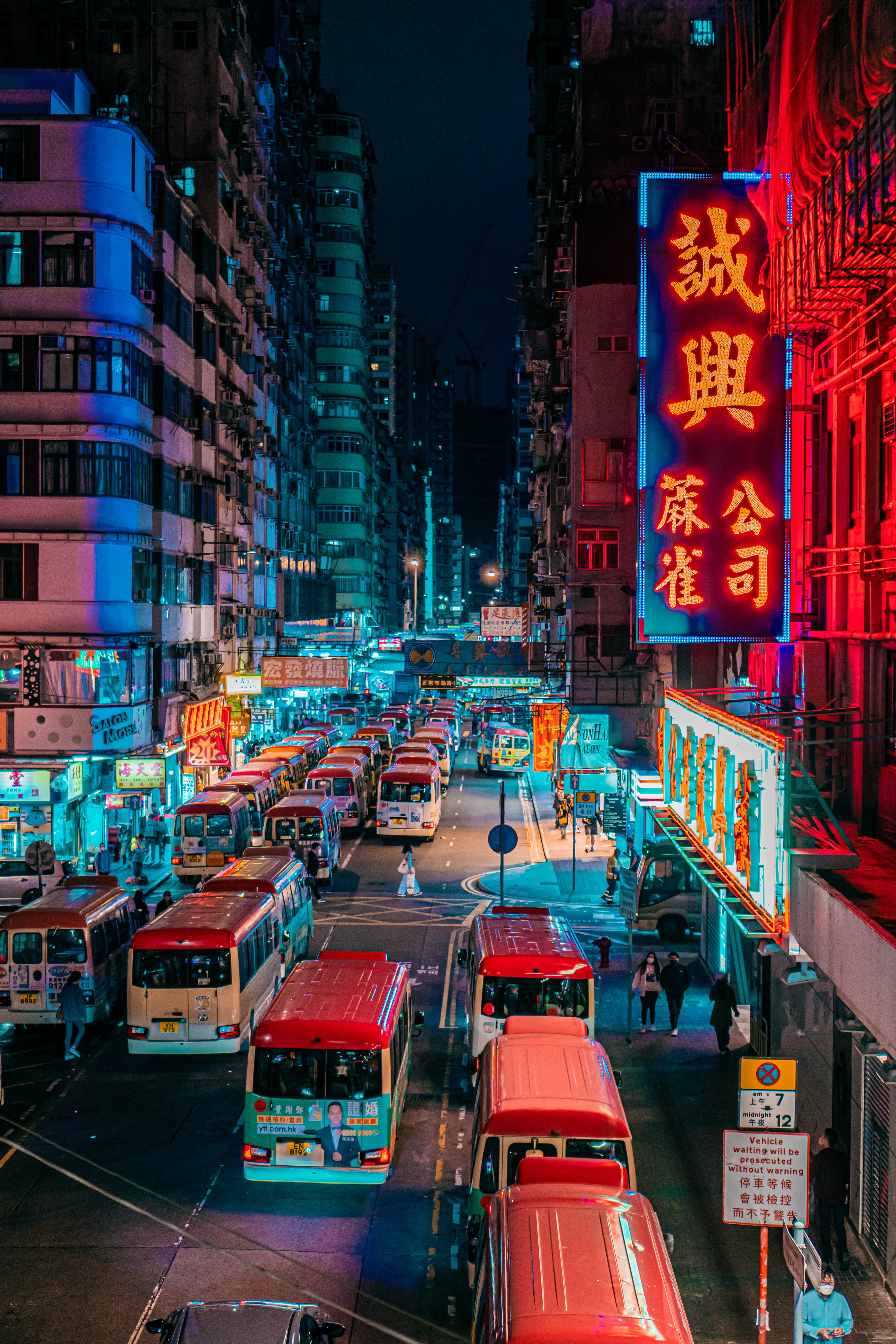 Hong Kong, red buses, neon-lit urban street, 5K Phone Wallpaper