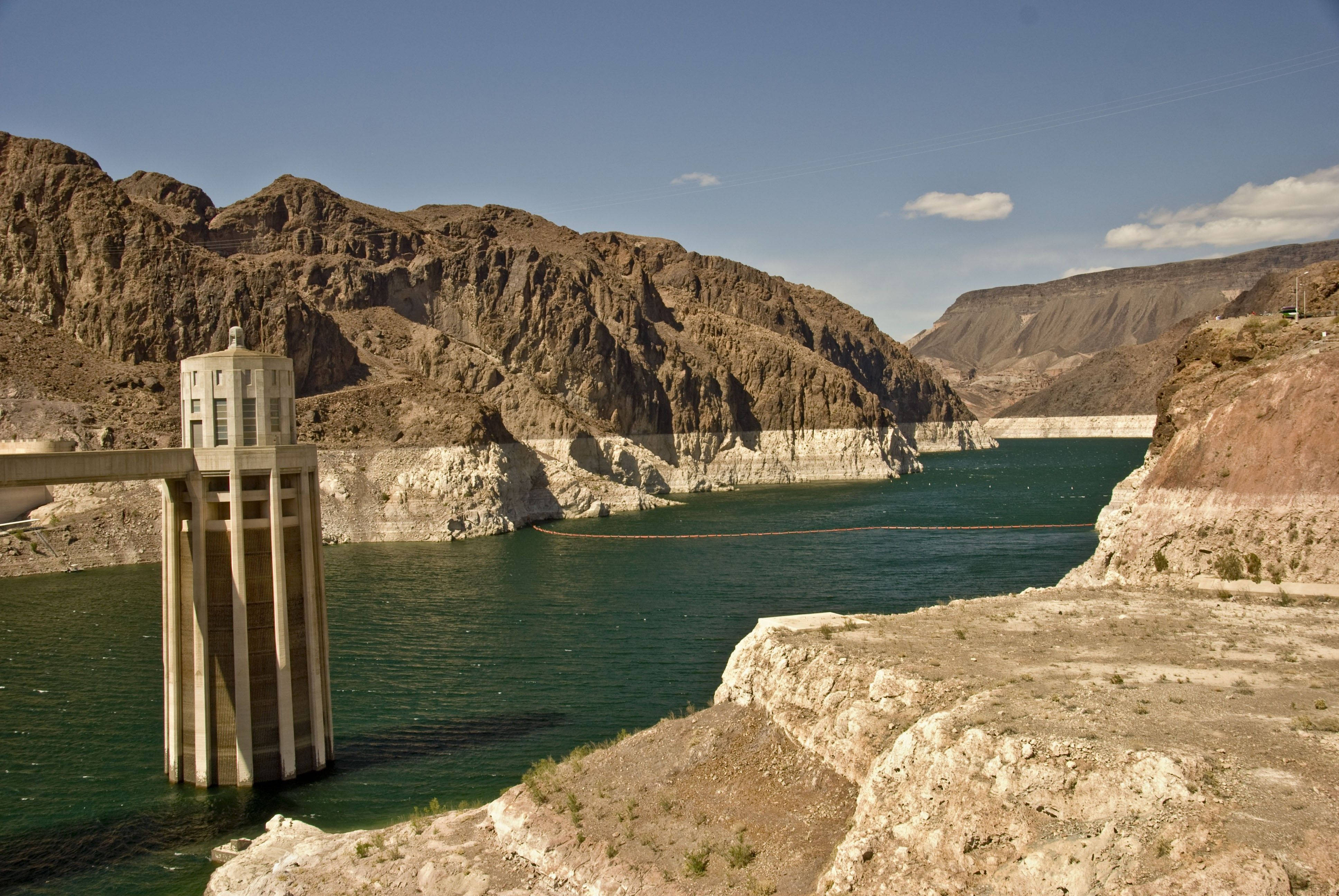 Hoover Dam, deep green reservoir, rugged brown canyon walls, 4K Desktop Wallpaper