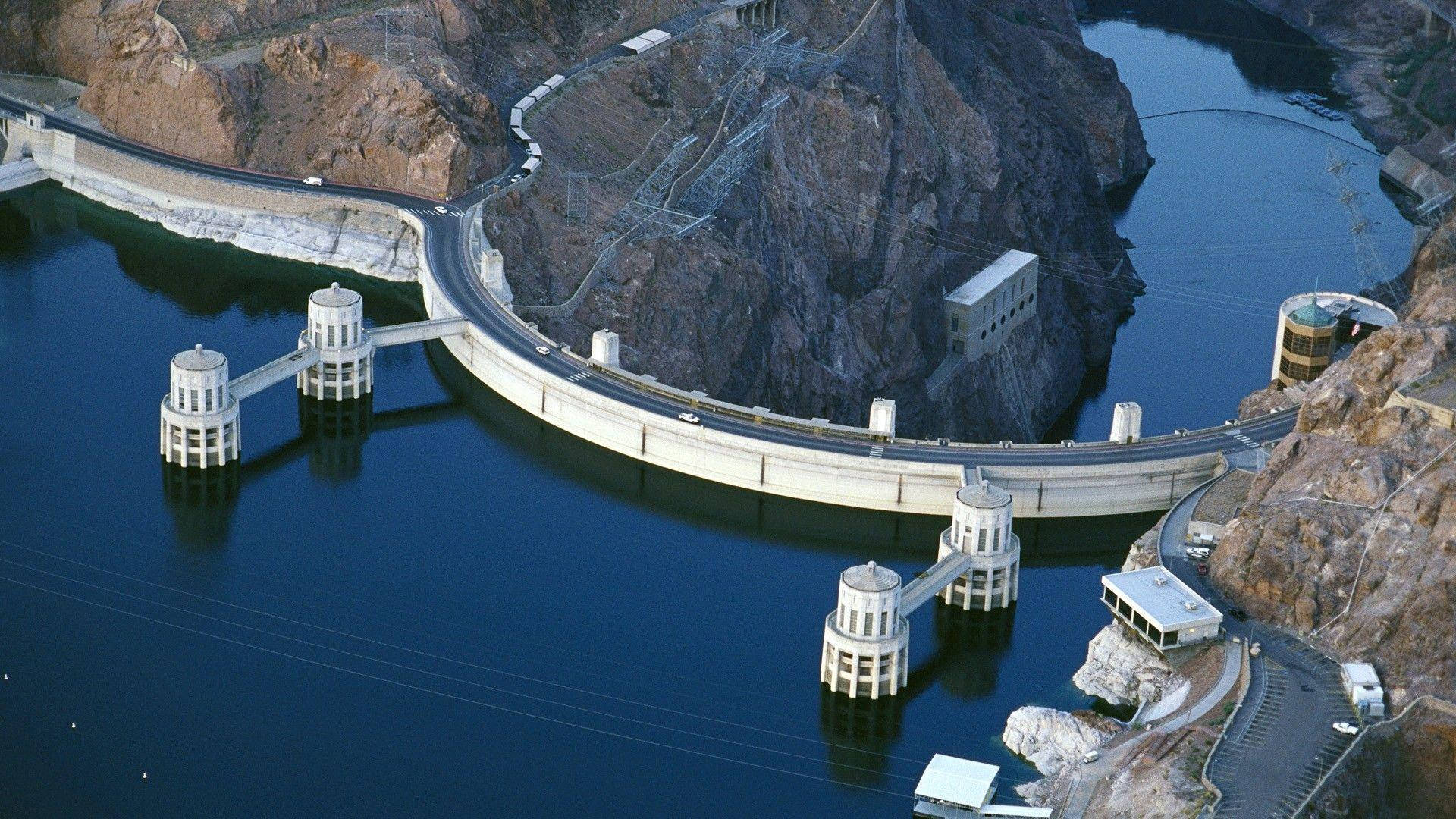 Hoover Dam, deep blue reservoir, rugged brown canyon walls, Full HD Desktop Wallpaper