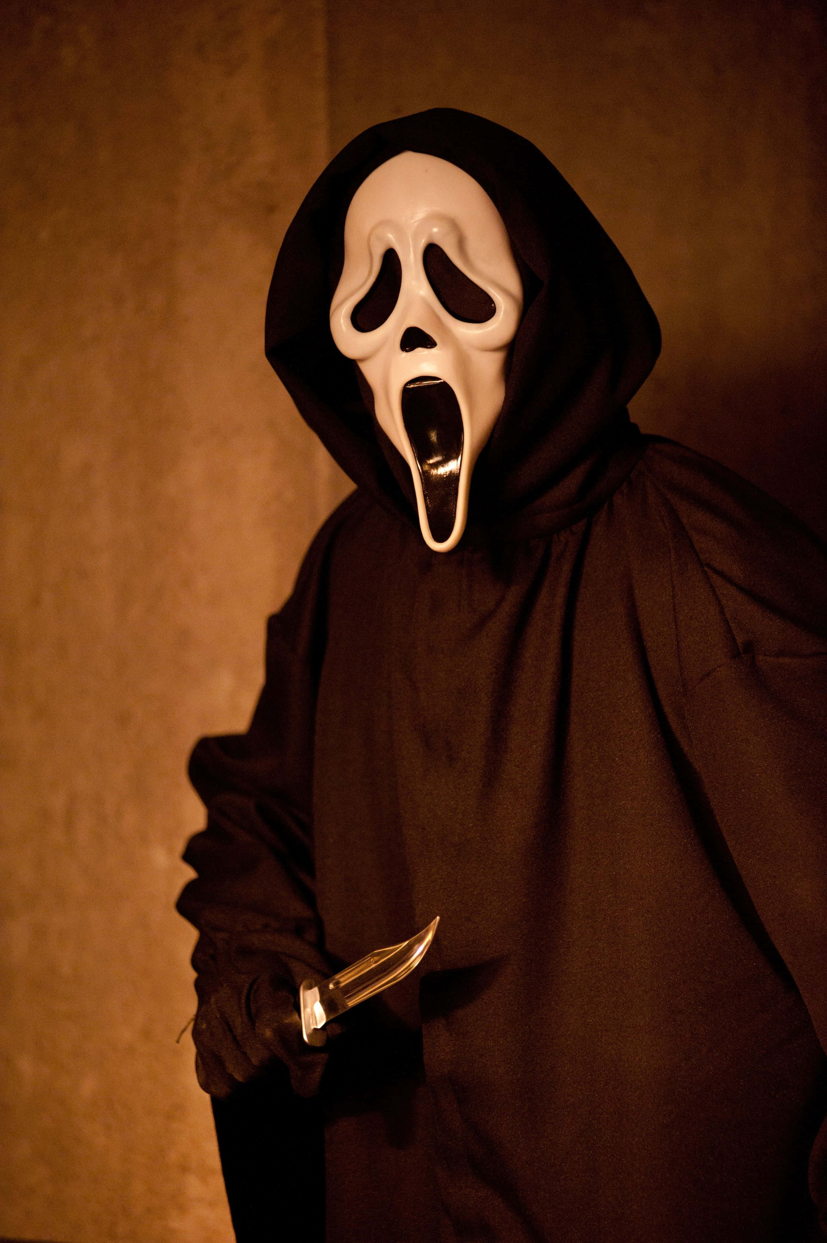 Sepia Light Ghost Face PFP, black hooded robe, white scream mask, 4K Phone Wallpaper
