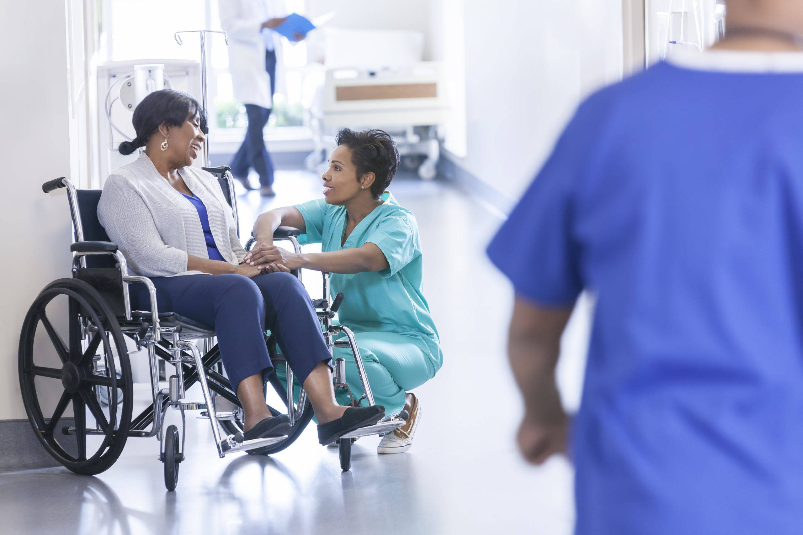 patient in wheelchair, nurse, bright hospital hallway, 2K Desktop Wallpaper