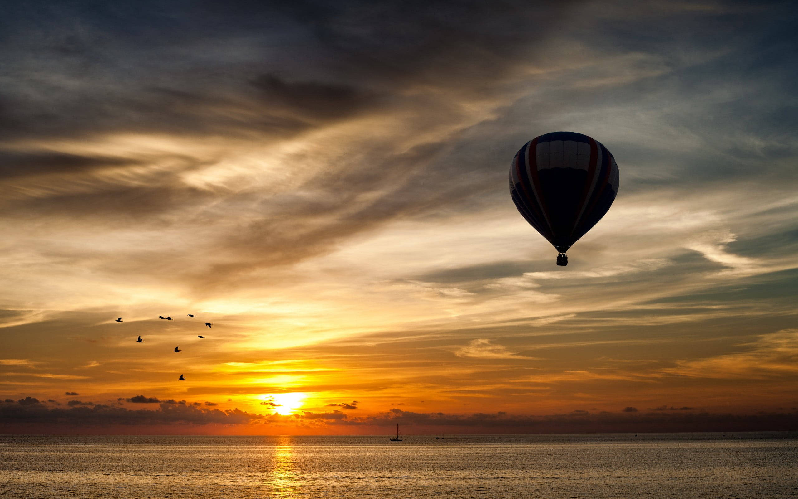 hot air balloon, fiery sunset, calm ocean waters, 2K Desktop Wallpaper